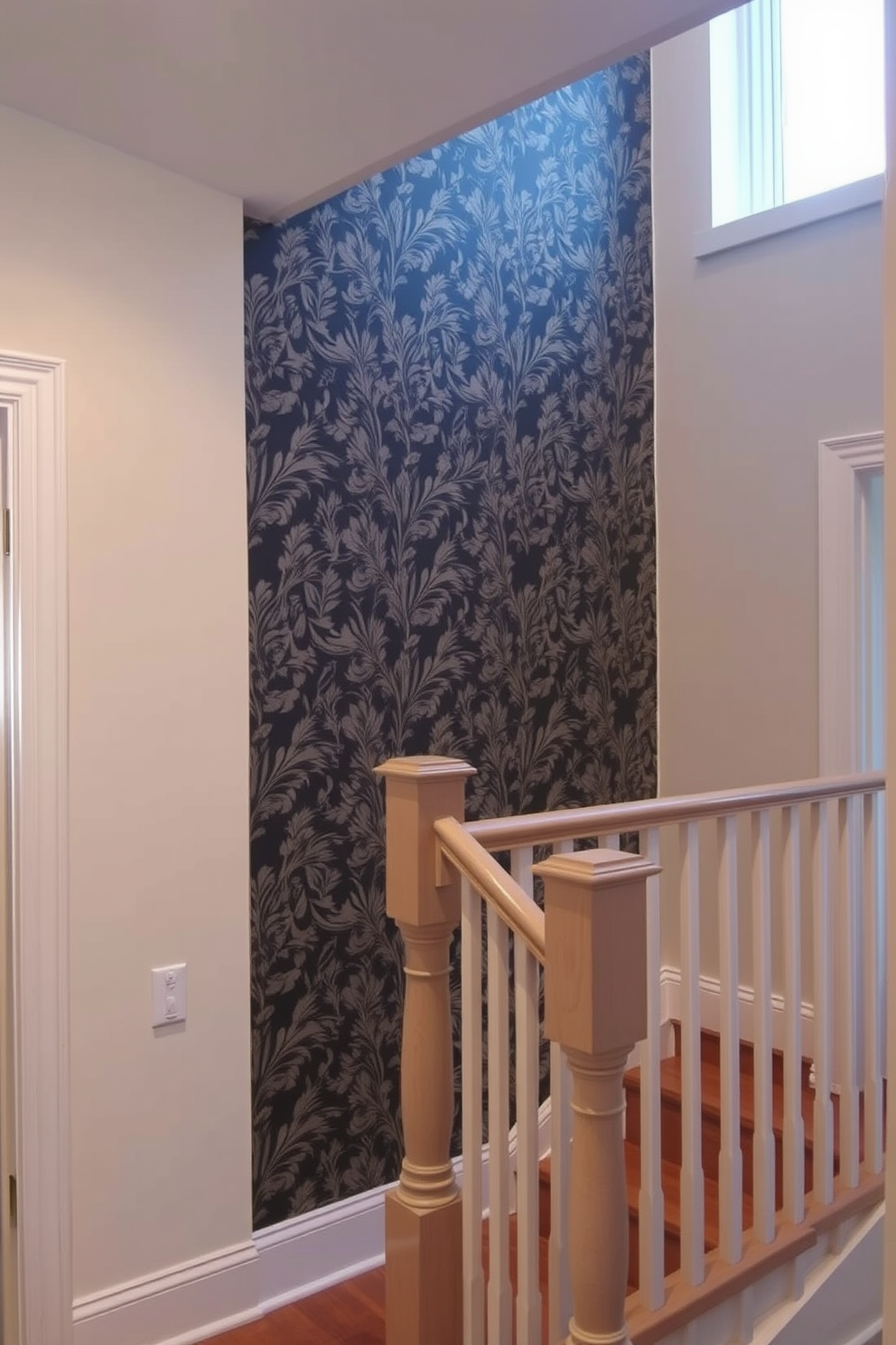 A striking accent wall adorned with intricate wallpaper featuring a botanical pattern creates a focal point in the room. The surrounding walls are painted in a soft neutral tone to enhance the vibrancy of the accent wall. The closed staircase features elegant wooden steps with a matching handrail that complements the overall design. Soft, recessed lighting illuminates the space, highlighting the craftsmanship of the staircase and creating a warm ambiance.