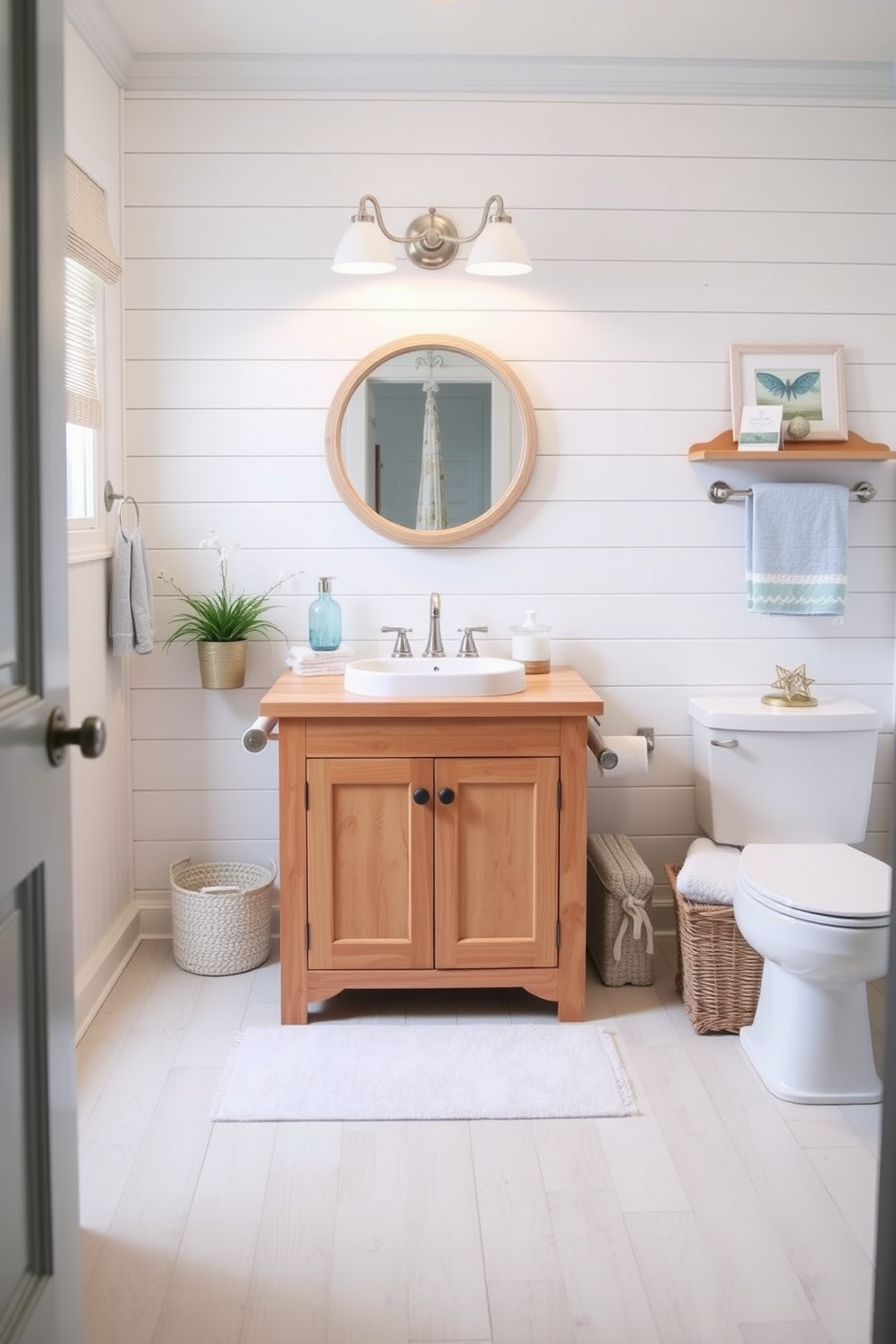 A natural wood vanity with a white sink is the focal point of this coastal bathroom design. The space is adorned with soft blue accents and nautical-themed decor, creating a serene and inviting atmosphere.