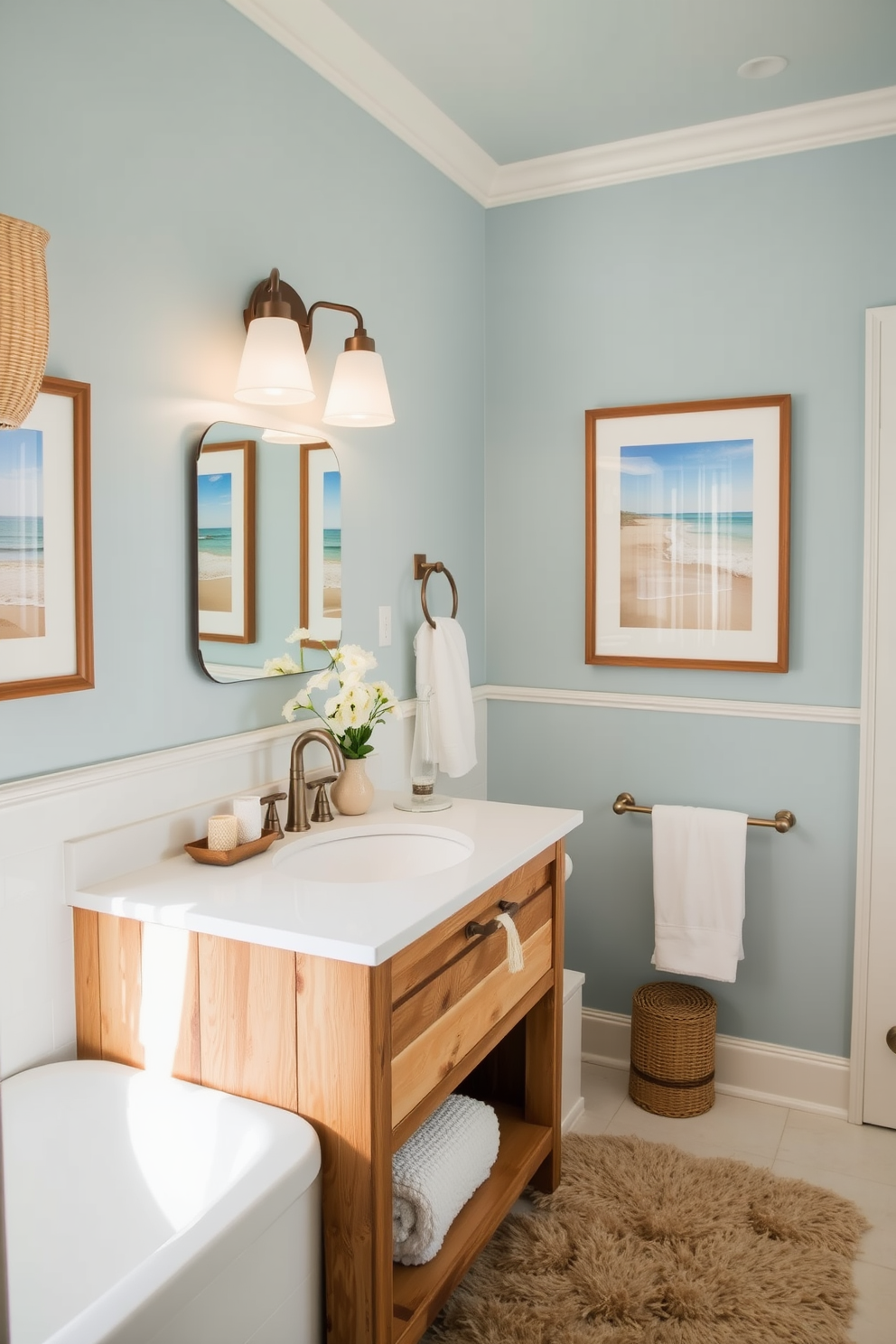 A serene coastal bathroom featuring framed beach photographs adorning the walls. The space is accented with soft blue hues and natural textures, creating a calming atmosphere. The vanity is crafted from reclaimed wood, complemented by a white quartz countertop. Nautical-themed accessories and a plush area rug enhance the beach-inspired aesthetic.