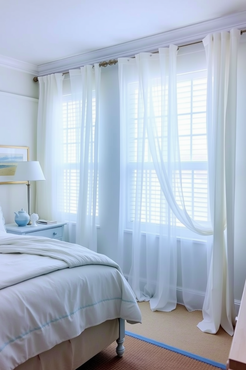 A coastal bedroom featuring rattan light fixtures that create a warm and inviting atmosphere. The room is adorned with soft blue and white textiles, complemented by natural wood accents and a large window that lets in ample sunlight.