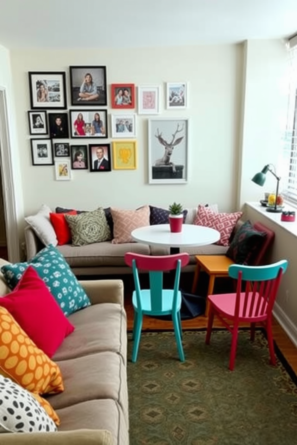 A lively college apartment featuring a cozy living area with a comfortable sofa adorned with colorful throw pillows in various patterns and textures. The walls are painted in a soft neutral tone, and a stylish area rug anchors the space, adding warmth and personality. The small dining nook includes a round table surrounded by mismatched chairs, each painted in bright, cheerful colors. A gallery wall of framed artwork and photographs adds character, showcasing the eclectic style of the residents.