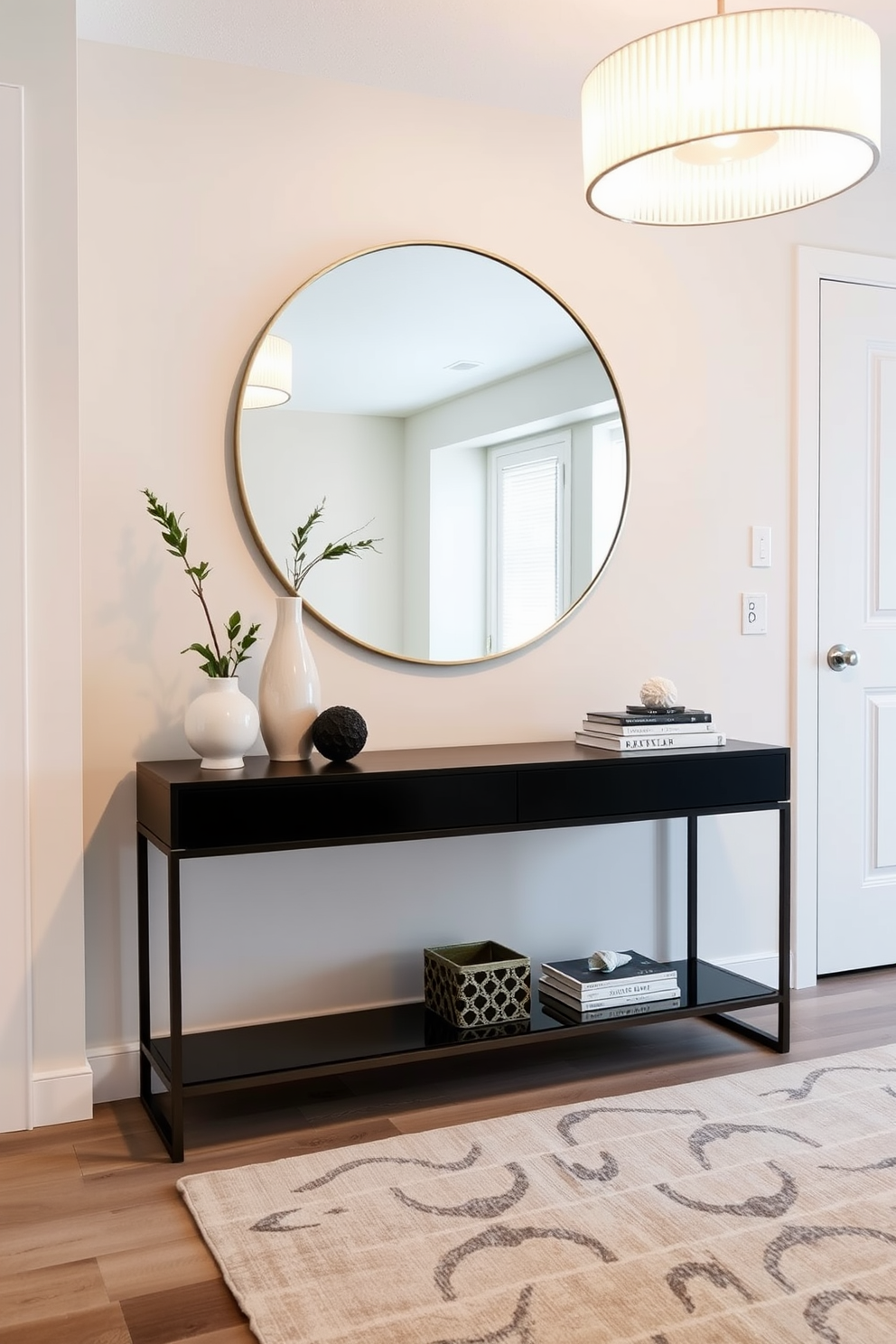 A chic condo entryway features a sleek console table against a wall adorned with a large round mirror. The floor is covered with a soft area rug, and a stylish light fixture hangs above, casting a warm glow over the space. To the side of the console table, a small potted plant adds a touch of greenery, while decorative items like a sculptural vase and a stack of design books create visual interest. The walls are painted in a soft neutral tone, enhancing the inviting atmosphere of the entryway.