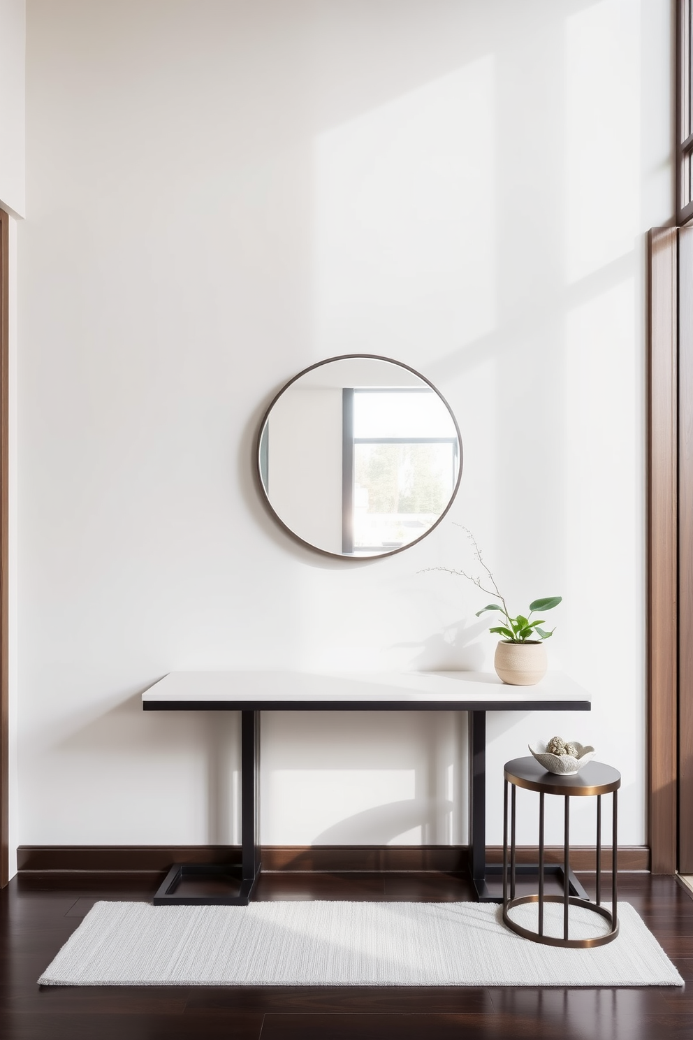 A stylish condo entryway featuring a sleek console table against the wall. Above the table, a large round mirror reflects natural light, enhancing the space's openness. To the right of the console table, a small side table adds an extra layer of decor. Adorning the side table is a decorative bowl and a small potted plant, creating a welcoming atmosphere.