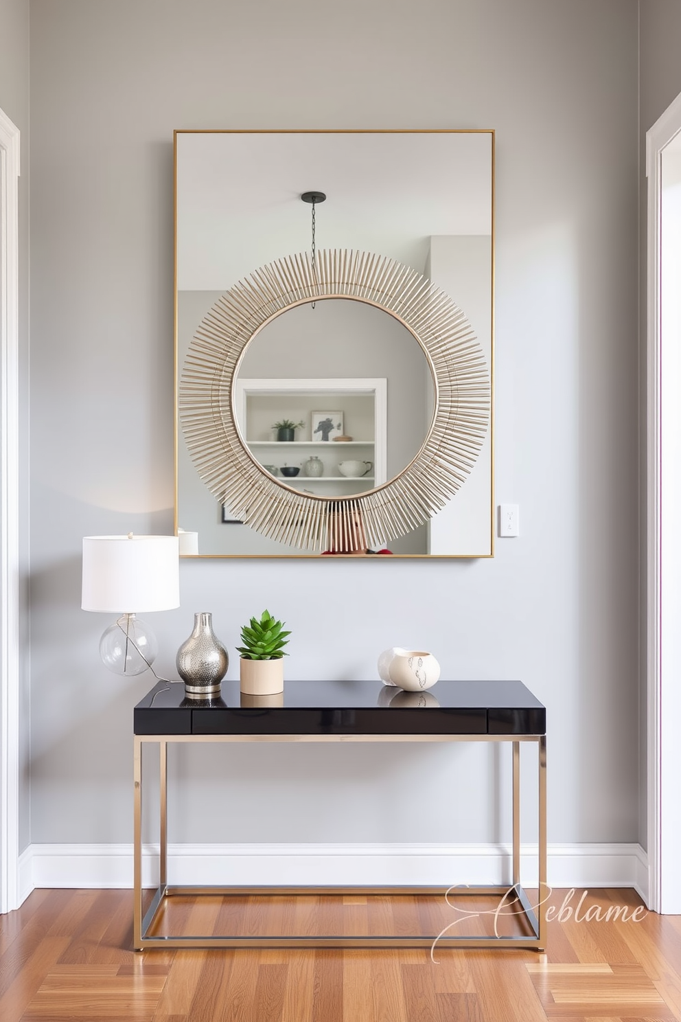 A stylish condo entryway featuring a statement mirror that enhances the sense of space and depth. The walls are painted in a soft gray hue, complemented by a sleek console table adorned with decorative objects and a small potted plant.