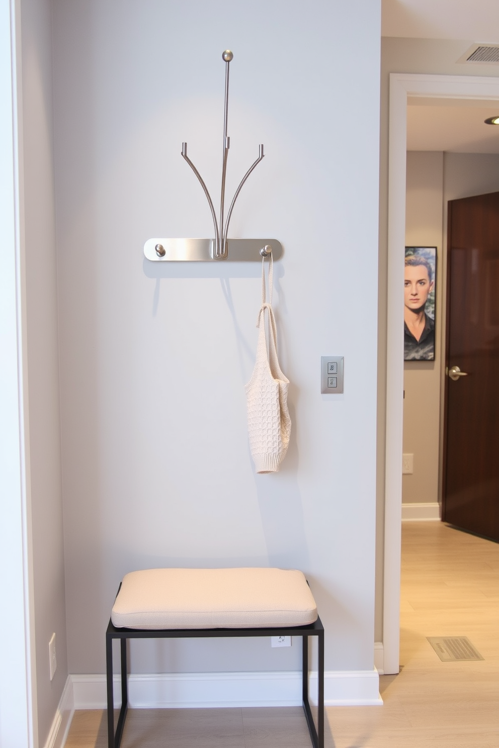 A stylish condo entryway features a statement mirror that reflects light and creates the illusion of a larger space. The walls are painted in a soft neutral tone, and a sleek console table sits beneath the mirror, adorned with decorative accents and a small potted plant.