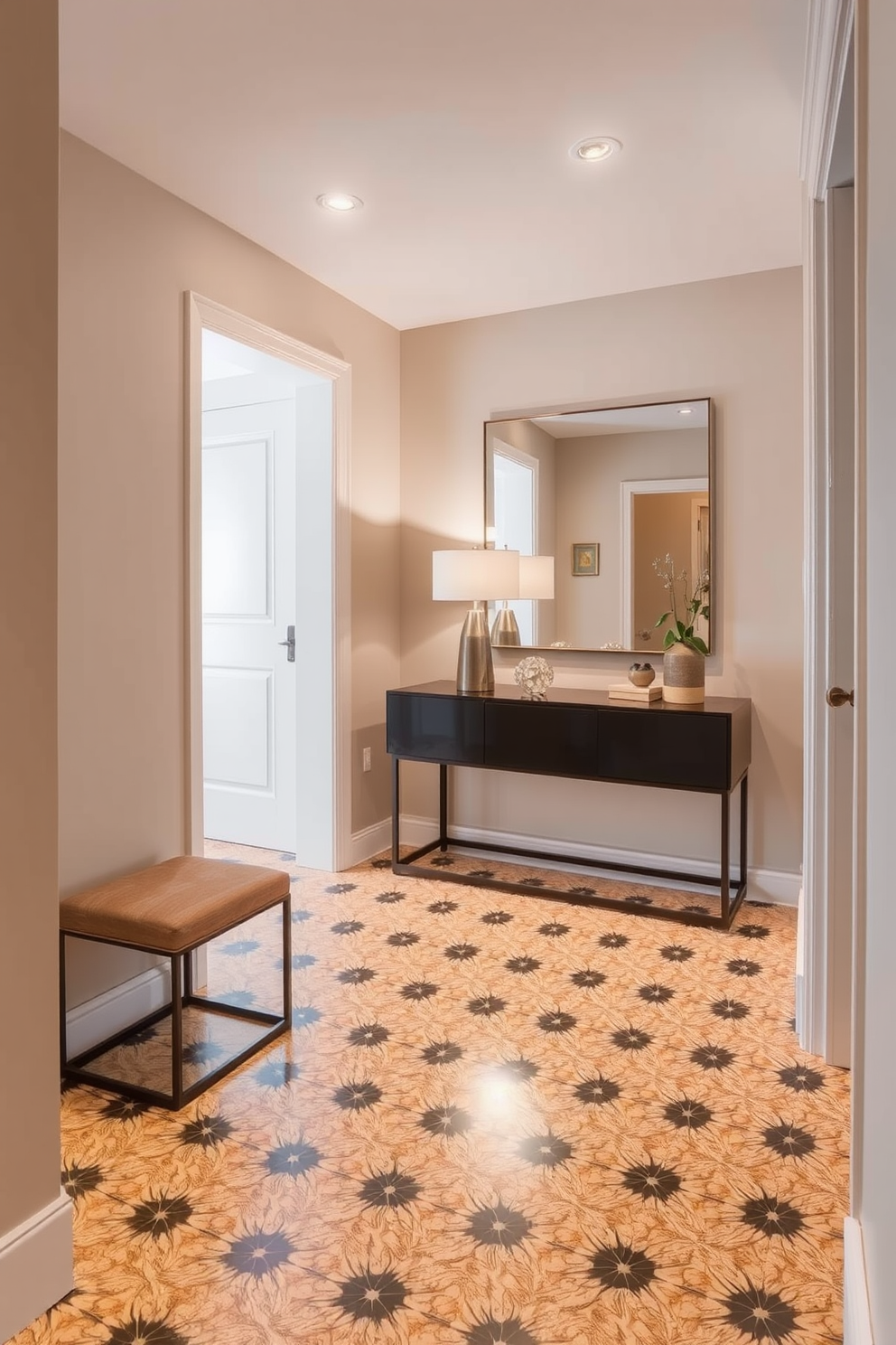 A stylish condo entryway features a striking patterned tile floor that adds visual interest and character to the space. The walls are painted in a soft neutral tone, creating a warm and inviting atmosphere. A sleek console table sits against one wall, adorned with decorative items and a chic lamp. A large mirror above the table reflects light and enhances the sense of space in the entryway.