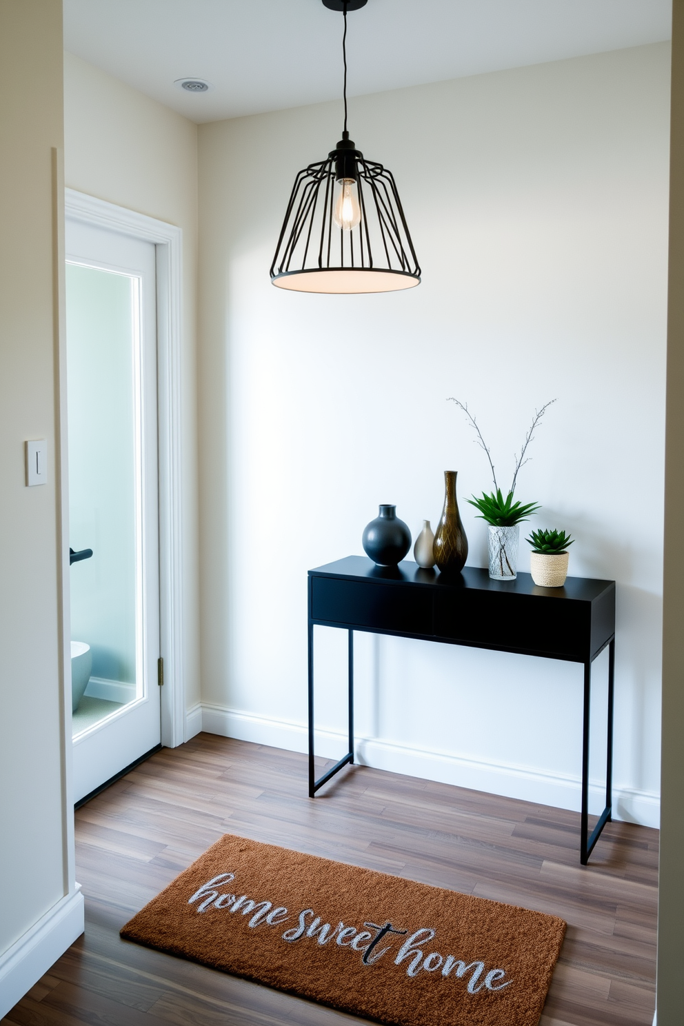 A stylish condo entryway featuring a welcoming doormat that reads Home Sweet Home. The space is illuminated by a modern pendant light, with a sleek console table against the wall adorned with decorative vases and a small potted plant.