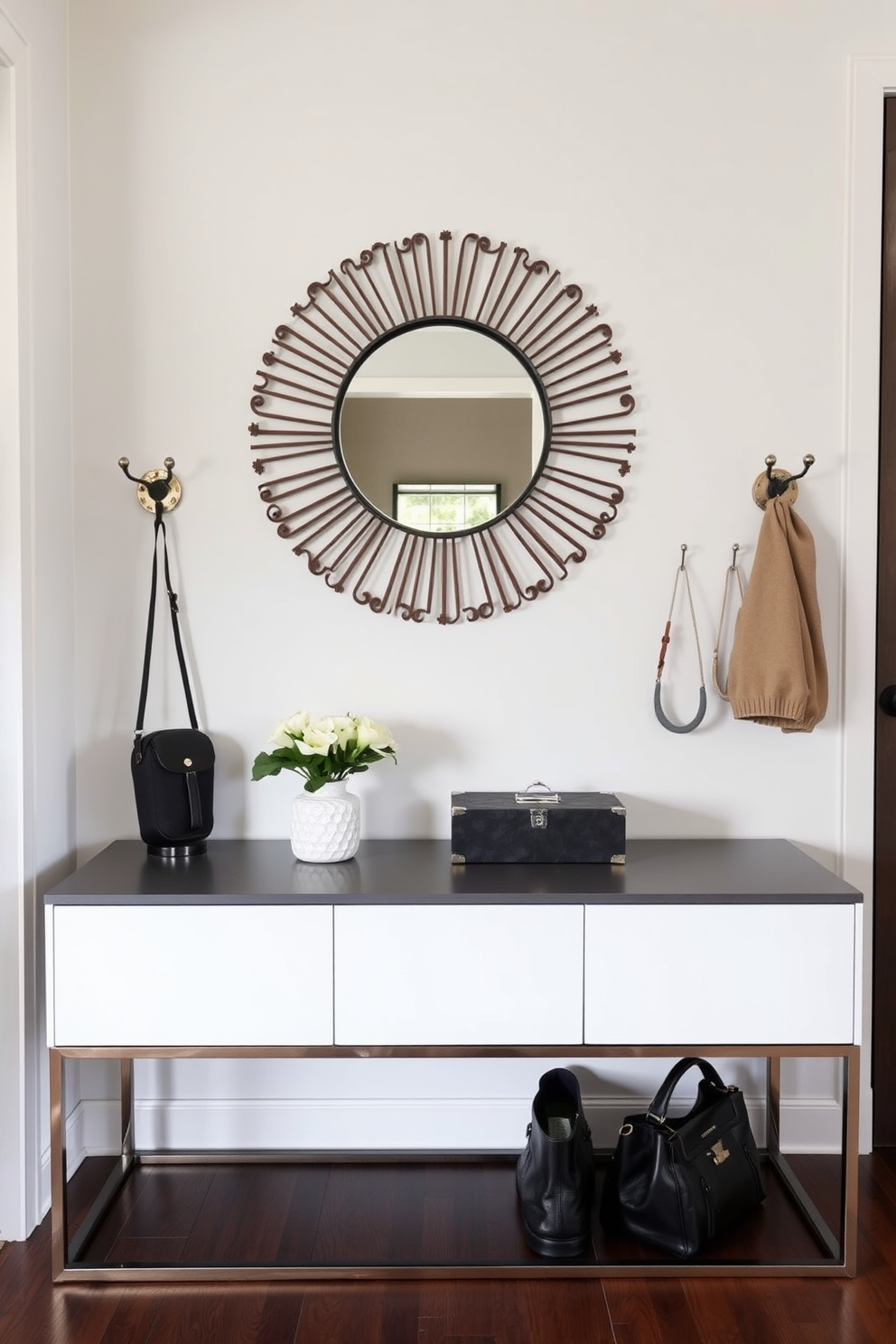 A warm and inviting entryway features layered rugs in various textures and patterns, creating a cozy atmosphere. The space is adorned with a sleek console table against the wall, complemented by decorative accents and a statement mirror above it.