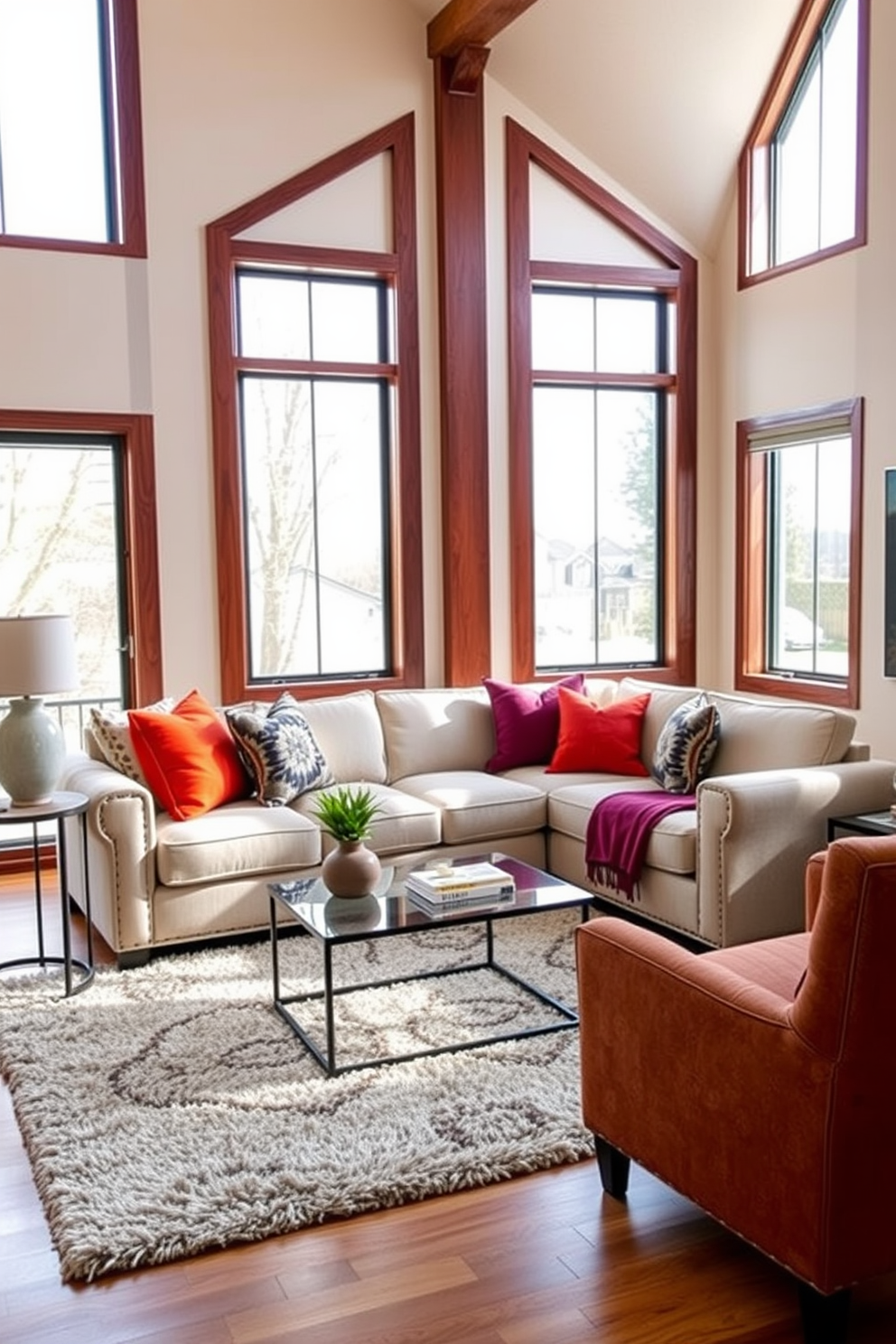 A cozy sectional sofa is positioned in the center of the living room, adorned with bold accent pillows in vibrant colors. Large windows allow natural light to flood the space, highlighting a stylish coffee table and a plush area rug beneath.