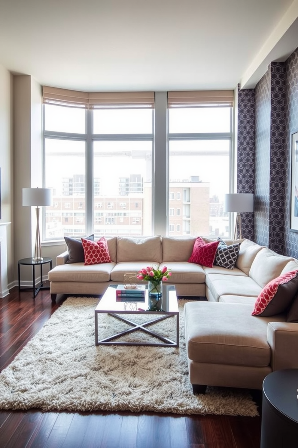 A stylish condo living room featuring an accent wall adorned with bold patterned wallpaper that adds depth and character to the space. The room is furnished with a plush sectional sofa in a neutral tone, complemented by colorful throw pillows that echo the accent wall's design. Natural light pours in through large windows, illuminating a sleek coffee table made of glass and metal. A cozy area rug anchors the seating arrangement, while modern art pieces hang on the remaining walls, enhancing the overall aesthetic.