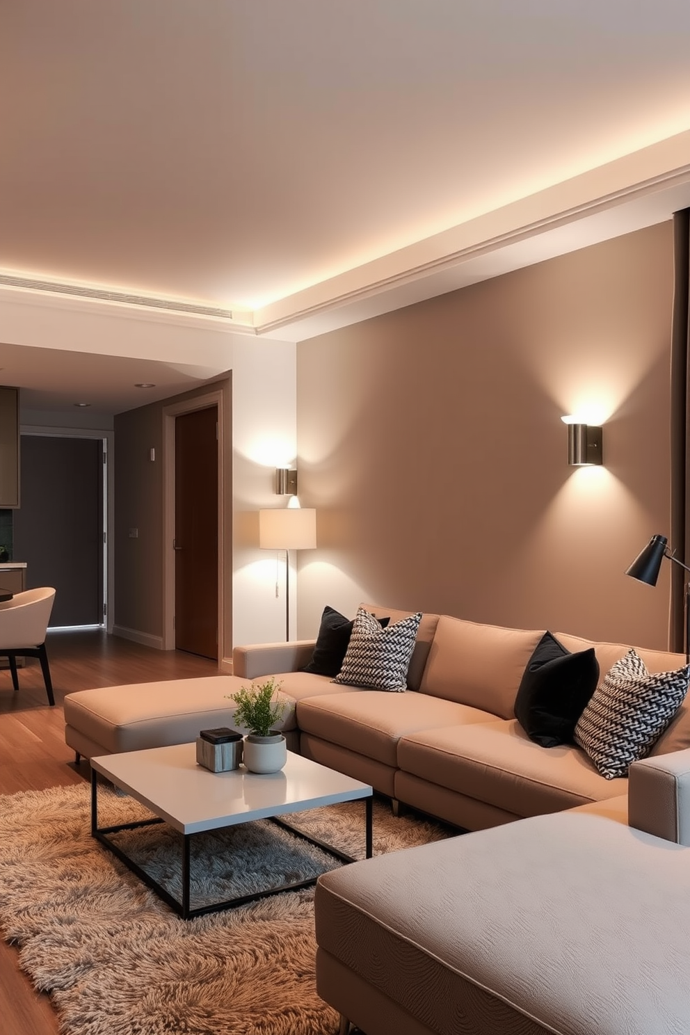 Layered lighting creates a warm and inviting atmosphere in a contemporary apartment. Soft overhead lights complement strategically placed floor and table lamps, enhancing the overall aesthetic. The living area features a sleek sectional sofa adorned with textured throw pillows. A minimalist coffee table sits atop a plush area rug, while wall-mounted sconces provide additional illumination.