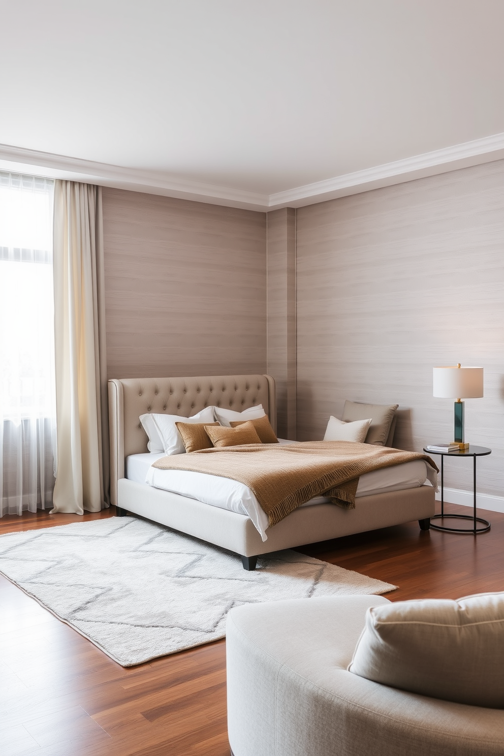 A contemporary bedroom featuring a neutral color palette that includes soft beige and warm gray tones. The space is adorned with vibrant artwork that adds a pop of color and personality to the room. The bed is dressed in crisp white linens with accent pillows in complementary shades. A sleek nightstand with a modern lamp sits on one side, while a cozy reading nook with a stylish chair is positioned near a large window.