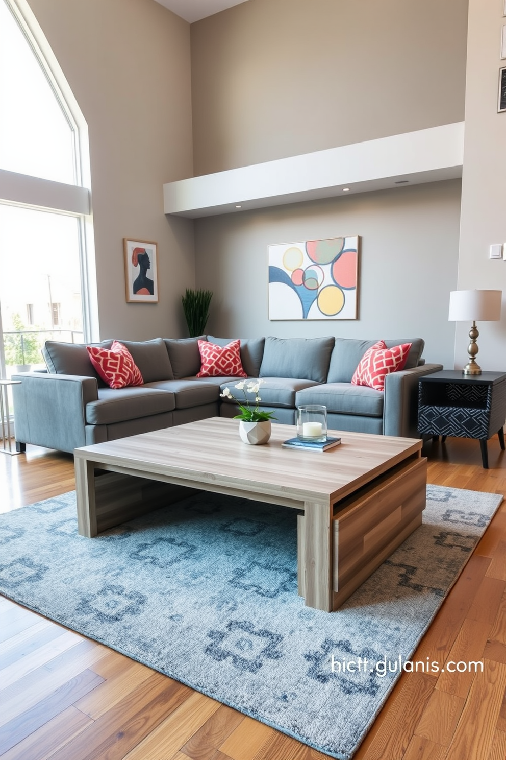 A multifunctional coffee table with built-in storage sits at the center of a contemporary family room. The table features a sleek design with a light wood finish, complementing the plush gray sectional sofa and vibrant accent pillows. Surrounding the coffee table are a pair of stylish armchairs, upholstered in a bold geometric pattern. Large windows allow natural light to flood the space, highlighting the warm tones of the wooden flooring and the modern artwork on the walls.