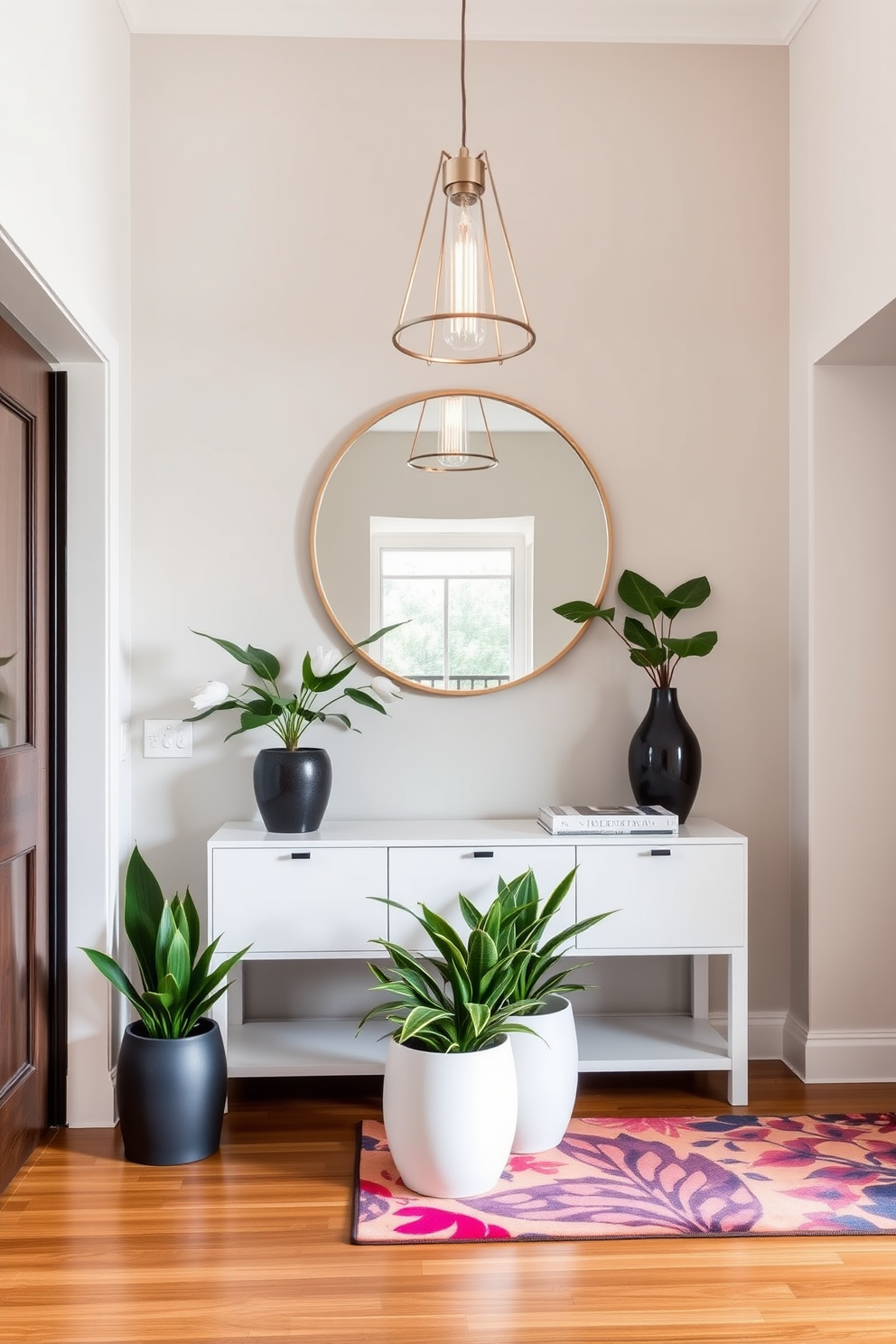 A contemporary foyer features a sleek console table with a minimalist design, complemented by a large round mirror above it. The walls are adorned with a neutral palette, and a statement pendant light hangs from the ceiling, casting a warm glow. The flooring consists of polished hardwood, adding warmth to the space, while a vibrant area rug anchors the seating area. Potted plants in stylish planters are placed strategically to bring a touch of nature indoors, enhancing the cohesive decor theme throughout the foyer.