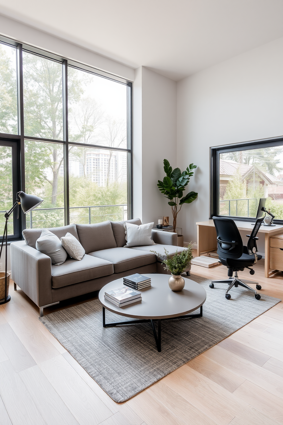 A comfortable seating area for breaks features a plush sectional sofa in a soft gray fabric. A round coffee table sits in front of the sofa, adorned with a few stylish coffee table books and a decorative plant. The contemporary home office design includes a sleek desk with a minimalistic design and a comfortable ergonomic chair. Large windows allow natural light to flood the space, enhancing the modern aesthetic with light wood flooring and neutral wall colors.