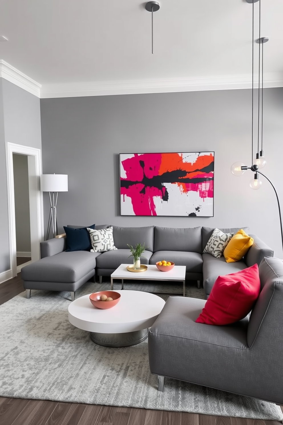 A contemporary living room featuring a monochromatic color scheme with various shades of gray. Bold pops of color are introduced through vibrant throw pillows and a striking piece of abstract art on the wall. The furniture includes a sleek gray sectional sofa paired with a minimalist coffee table. A stylish area rug anchors the space, while a mix of modern lighting fixtures adds warmth and character.