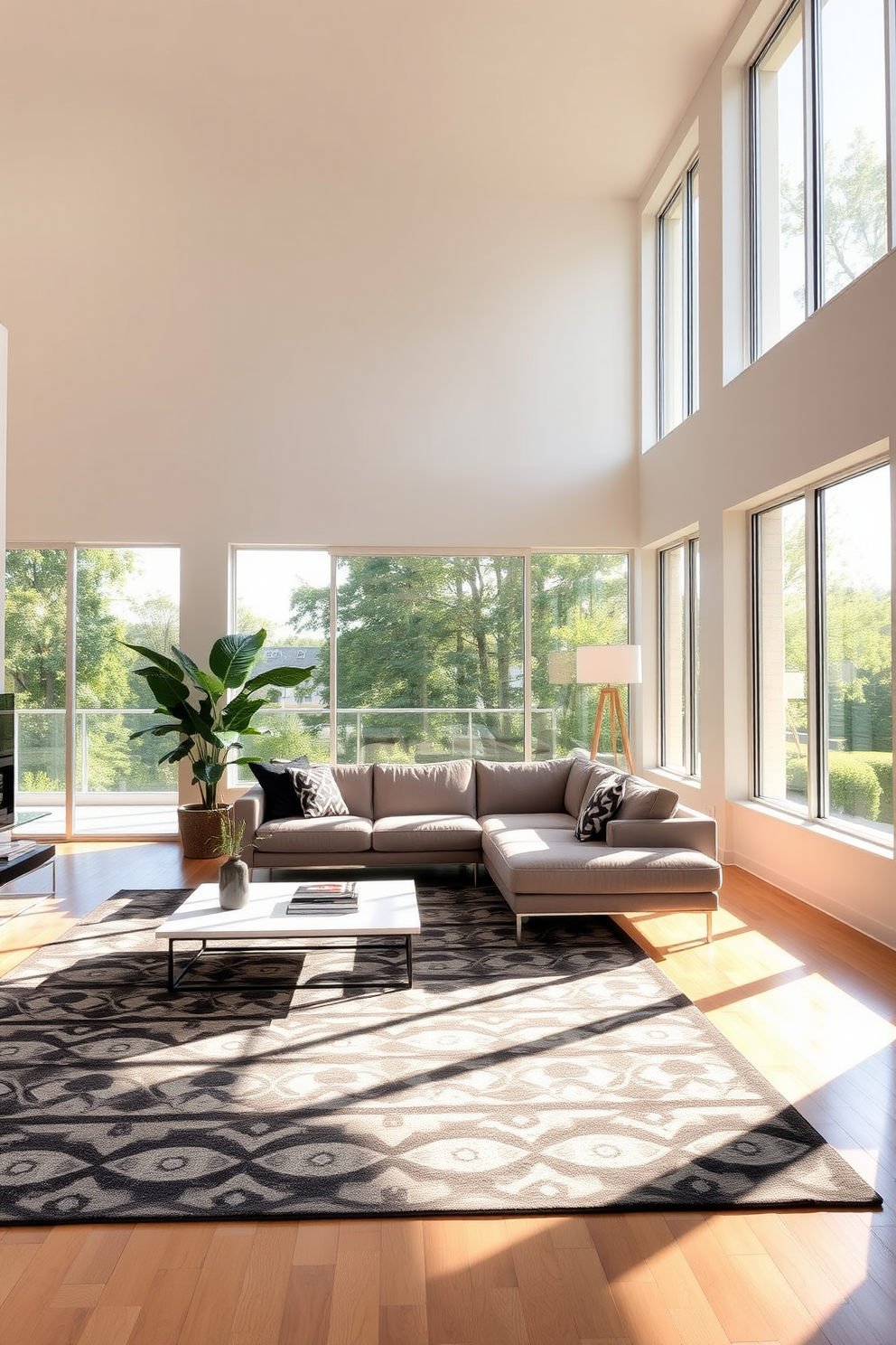 A contemporary living room filled with abundant natural light streaming through large floor-to-ceiling windows. The space features a sleek sectional sofa in a neutral tone, complemented by a bold geometric area rug and minimalist coffee table.