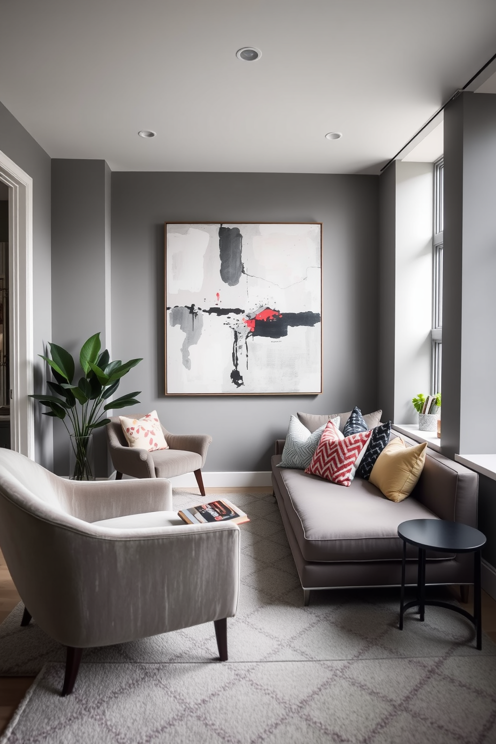 A stylish contemporary living room features a cozy reading nook by the window with a plush armchair and a small side table. The walls are painted in soft gray, complemented by a large abstract painting above a sleek sofa adorned with colorful cushions.