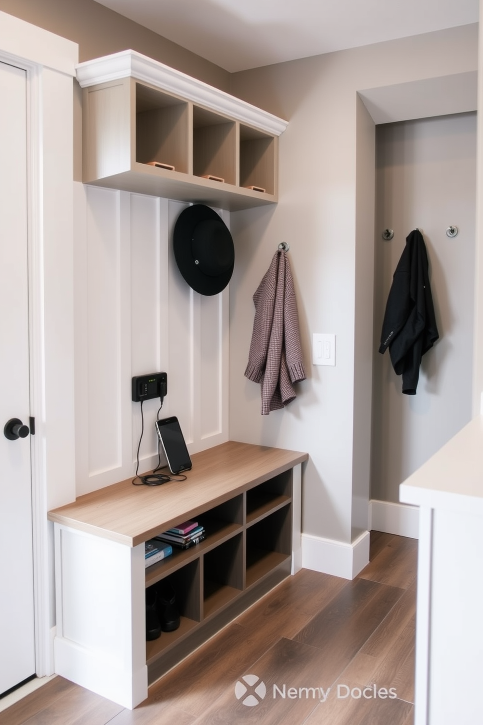 A contemporary mudroom features a spacious layout with built-in storage solutions including a bench and cubbies for shoes and bags. The walls are painted in a light gray tone, complemented by a durable tile floor that adds functionality and style. Large mirrors are strategically placed to enhance the perception of space, reflecting natural light and making the area feel more open. Stylish hooks and a sleek coat rack are mounted on one wall, providing practicality while maintaining a modern aesthetic.