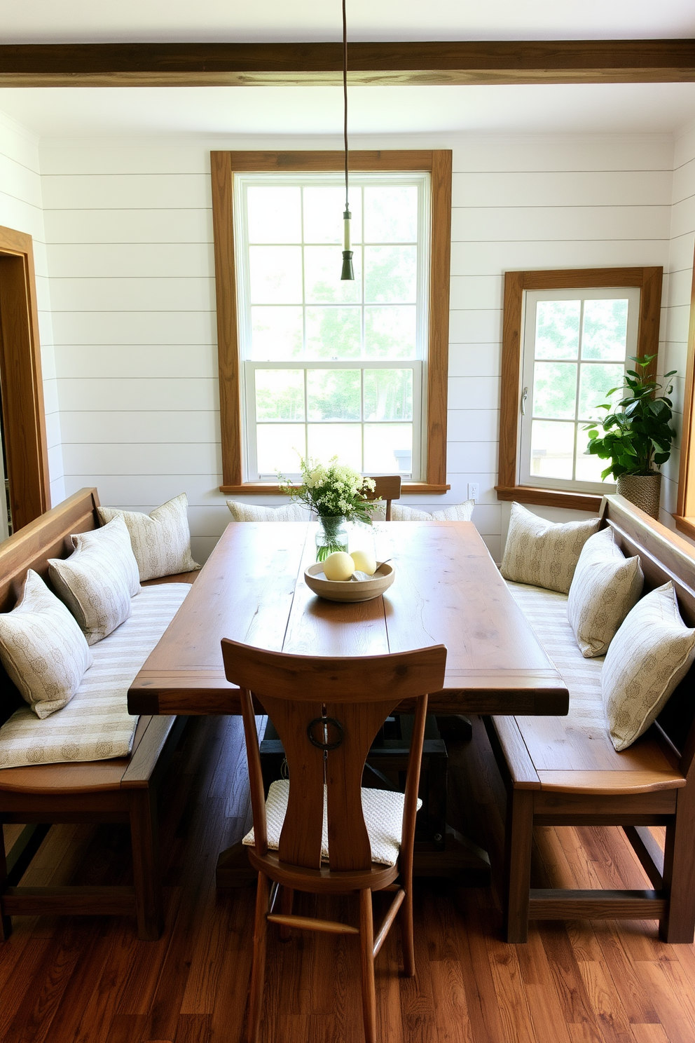 A cozy corner dining room featuring natural wood tones that create a warm and inviting atmosphere. The table is crafted from reclaimed wood, surrounded by comfortable upholstered chairs in soft neutral fabrics. Large windows allow plenty of natural light to flood the space, highlighting the rich textures of the wood. A statement pendant light hangs above the table, adding a touch of elegance to the design.