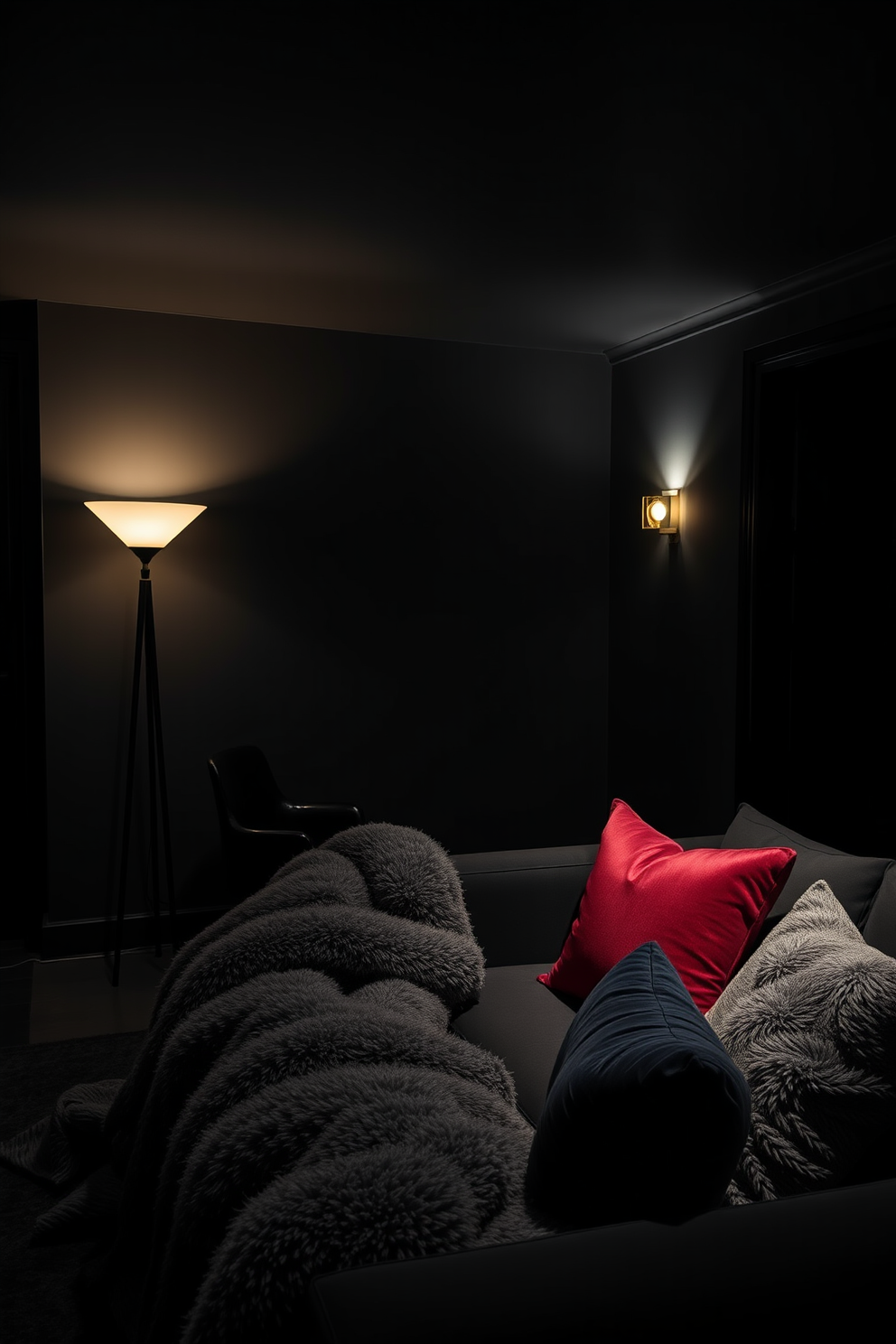 A moody and intimate atmosphere is created in a dark apartment featuring low lighting controlled by dimmer switches. The walls are painted in deep charcoal, and sleek black furniture complements the overall aesthetic, providing a sophisticated yet cozy feel. Soft, warm light emanates from strategically placed floor lamps and wall sconces, enhancing the ambiance without overpowering the space. Plush textiles in rich jewel tones add comfort and contrast, inviting relaxation in this stylish retreat.