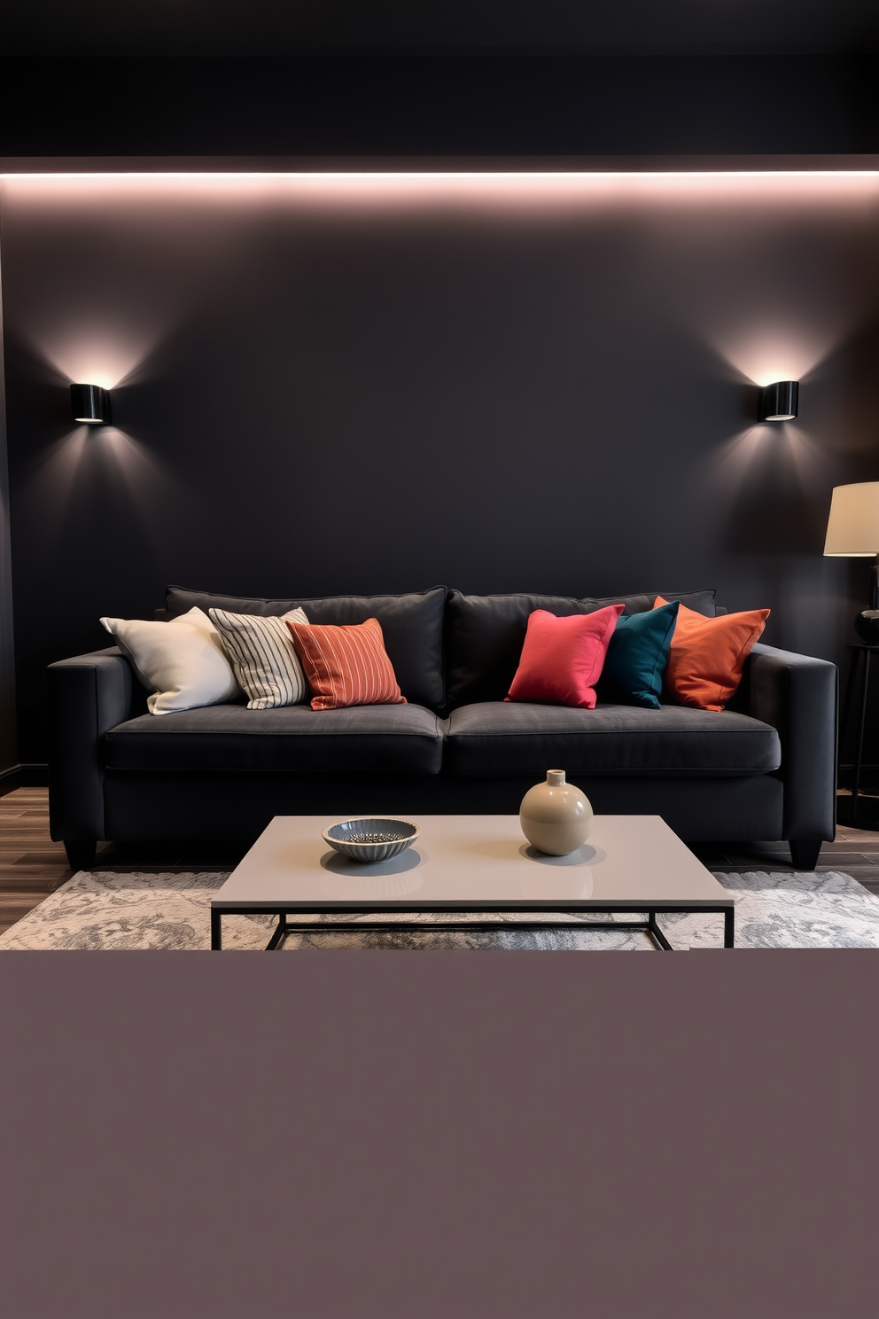 A charcoal gray sofa is positioned centrally in the room, adorned with a variety of colorful cushions that add a vibrant touch. The walls are painted in a deep shade, enhancing the cozy atmosphere of the dark apartment design. Soft ambient lighting is strategically placed to highlight the textures and colors within the space. A sleek coffee table in front of the sofa complements the modern aesthetic while providing a functional surface for decor and drinks.