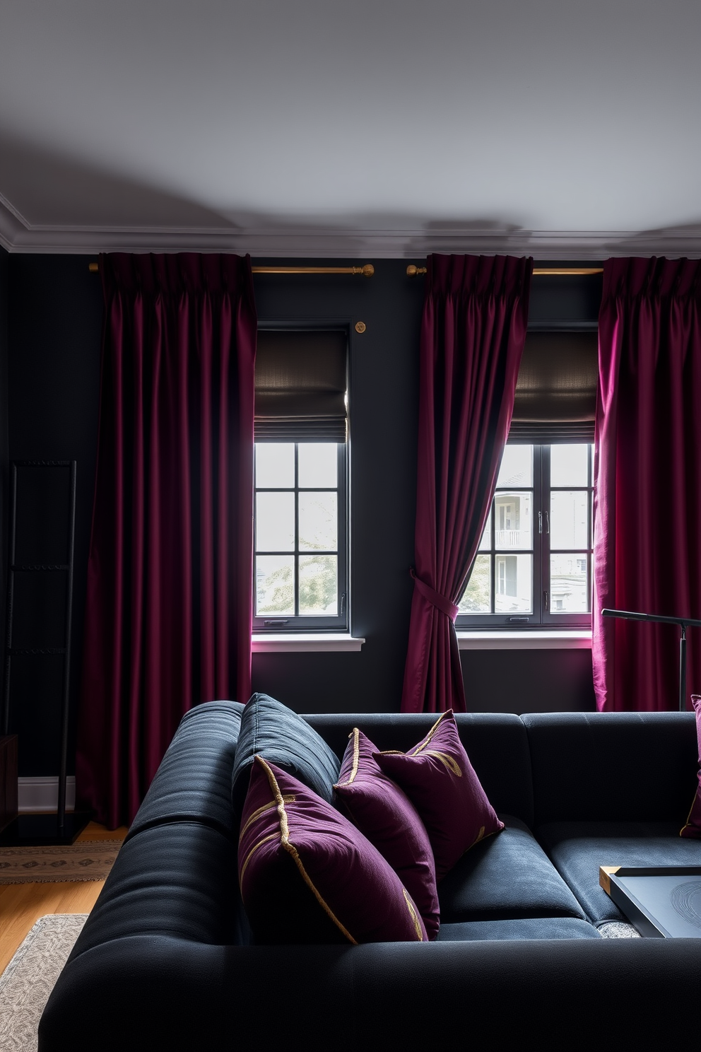 A dark apartment setting featuring rich burgundy curtains that add dramatic flair to the space. The walls are painted in deep charcoal, and the furnishings include a plush black sofa complemented by gold accents.