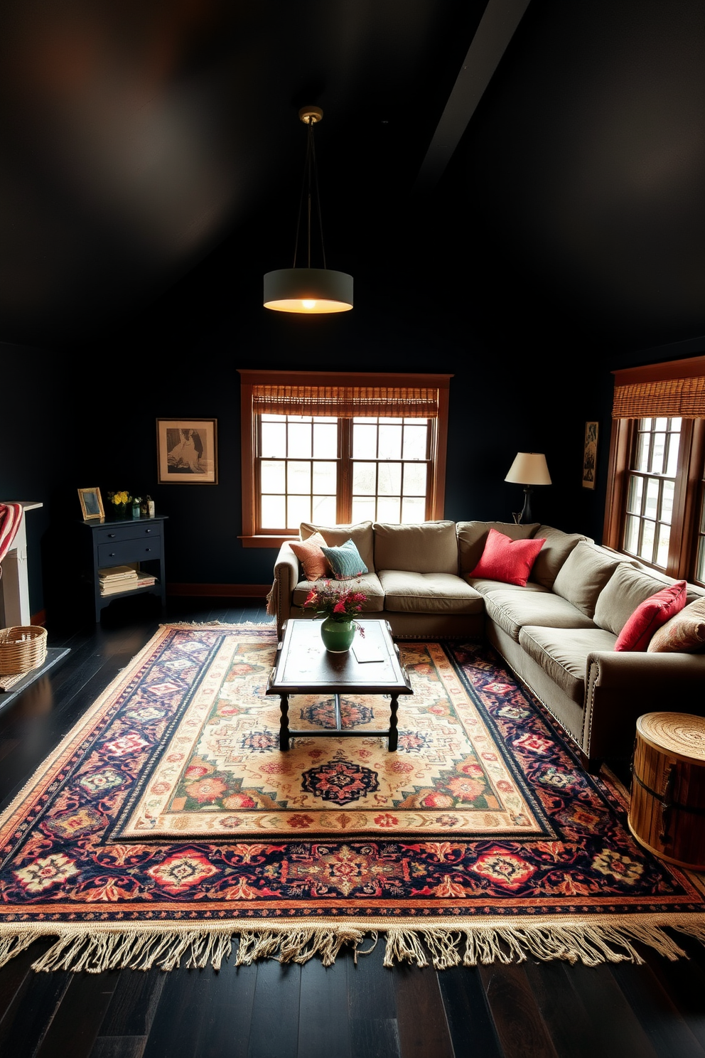 A cozy dark attic room features bold area rugs that define different spaces within the room. The walls are painted in a deep charcoal color, and large windows allow natural light to filter in, creating a warm ambiance. A plush sectional sofa is arranged around a striking geometric rug, while a vintage coffee table adds character to the seating area. Ambient lighting from stylish pendant fixtures enhances the room's intimate atmosphere, making it a perfect retreat.