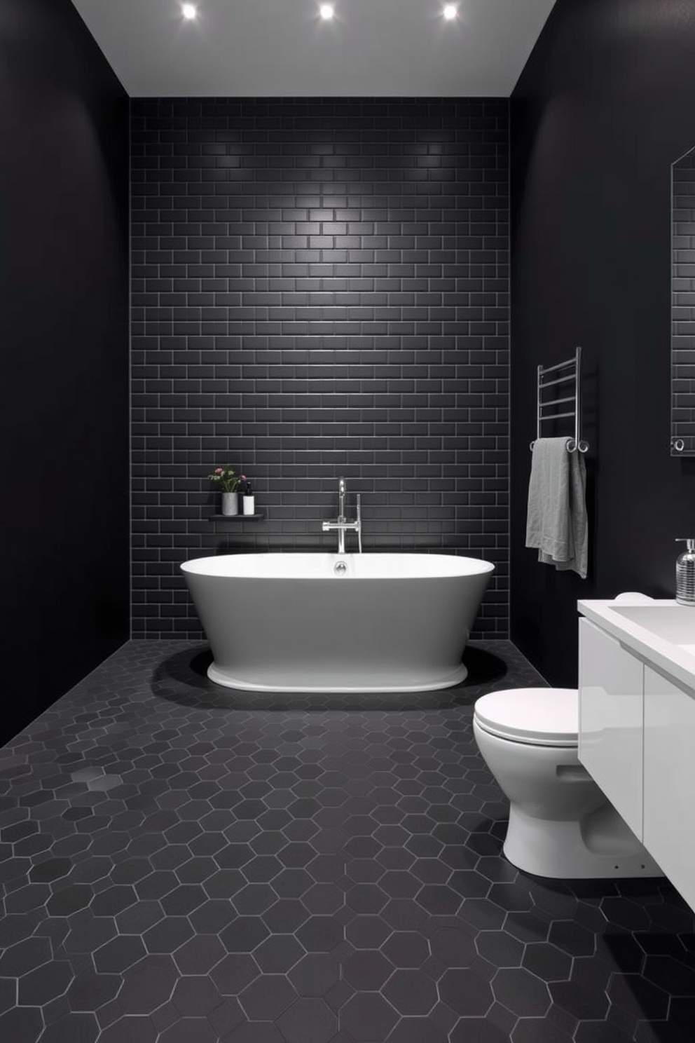 A striking dark bathroom design features black hexagon tiles that create a modern and stylish floor. The walls are painted in a deep charcoal shade, enhancing the contemporary feel of the space. A sleek freestanding bathtub sits in the center, surrounded by minimalist decor. Ambient lighting highlights the elegant fixtures and adds warmth to the overall aesthetic.