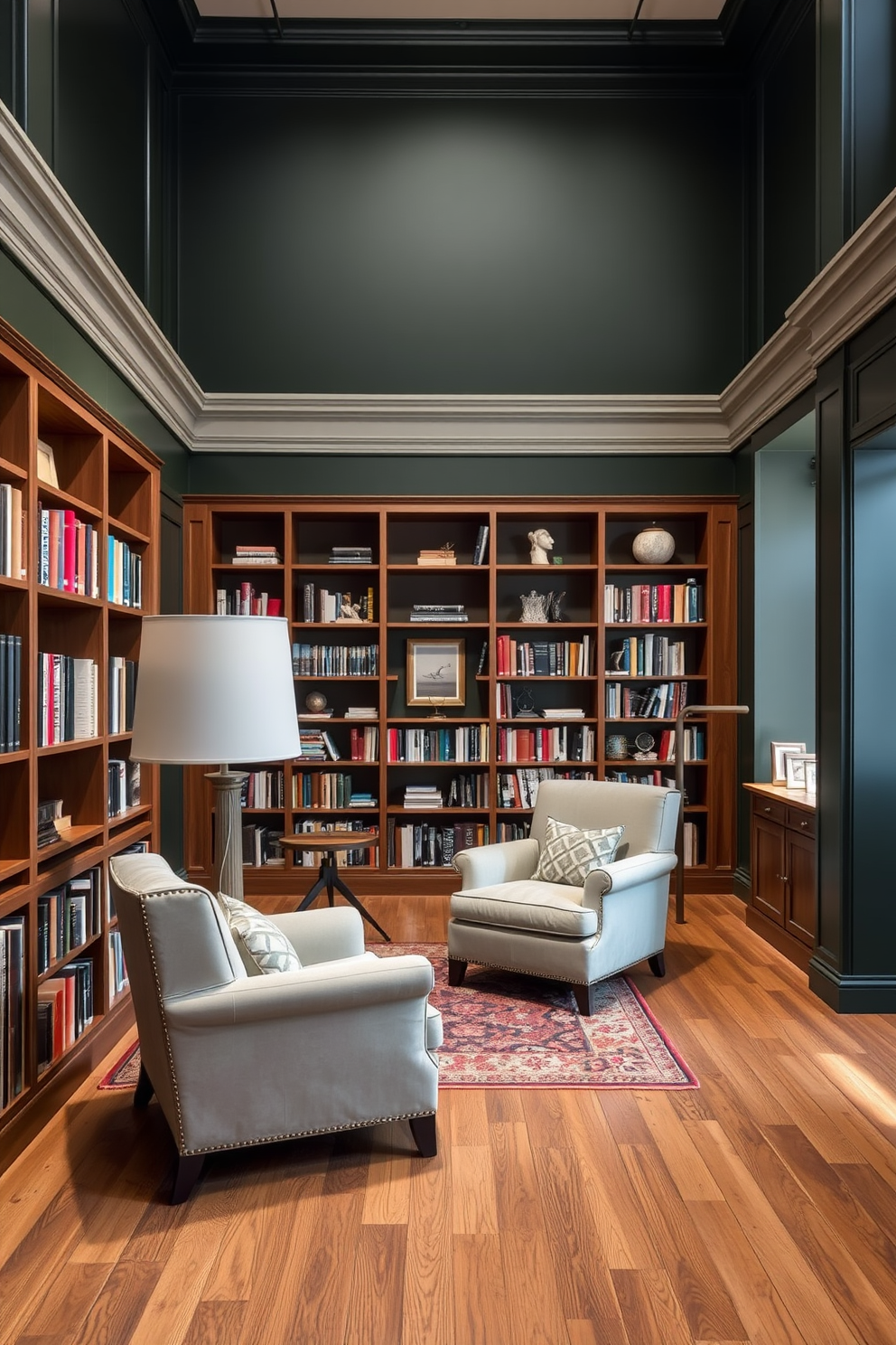 Open layout with cozy reading corners featuring plush armchairs and a large floor lamp. The walls are painted in a deep dark green, complemented by wooden bookshelves filled with books and decorative items.