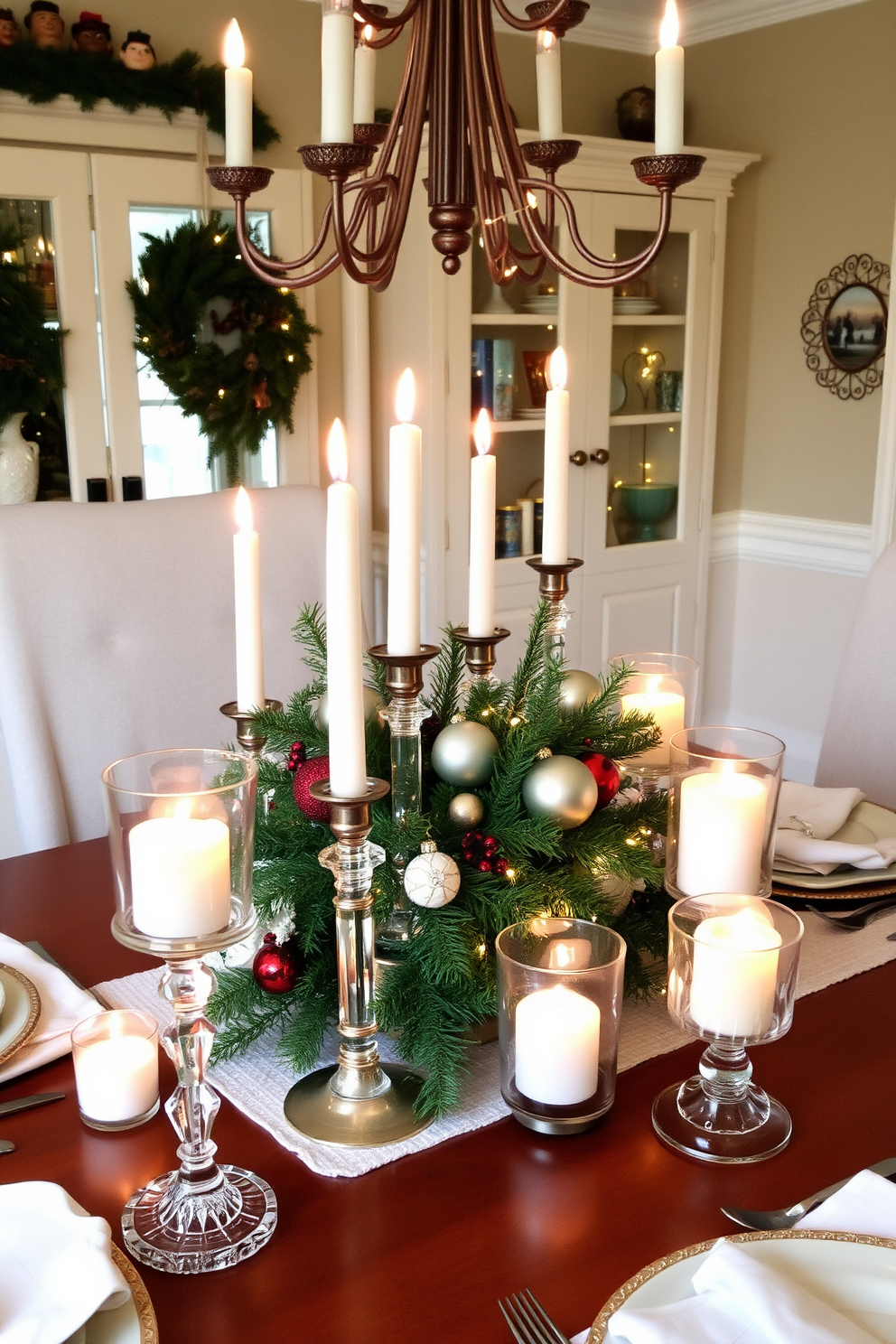 A cozy dining room adorned with candles in elegant glass holders creating a warm ambiance. The table is beautifully set with festive decorations, including a centerpiece of pine branches and ornaments, complemented by twinkling fairy lights.