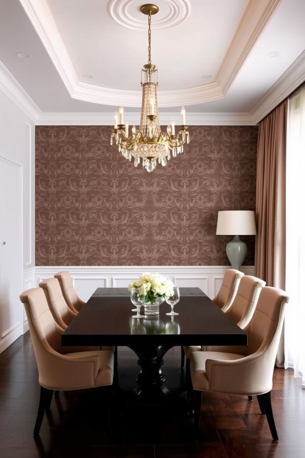 A stylish dining room featuring an accent wall adorned with intricate patterned wallpaper. The dining table is a dark wood finish, surrounded by elegant upholstered chairs in a complementary color. A stunning chandelier hangs above the table, casting a warm glow over the space. The room is further enhanced by a large window dressed with sheer curtains, allowing natural light to filter in beautifully.