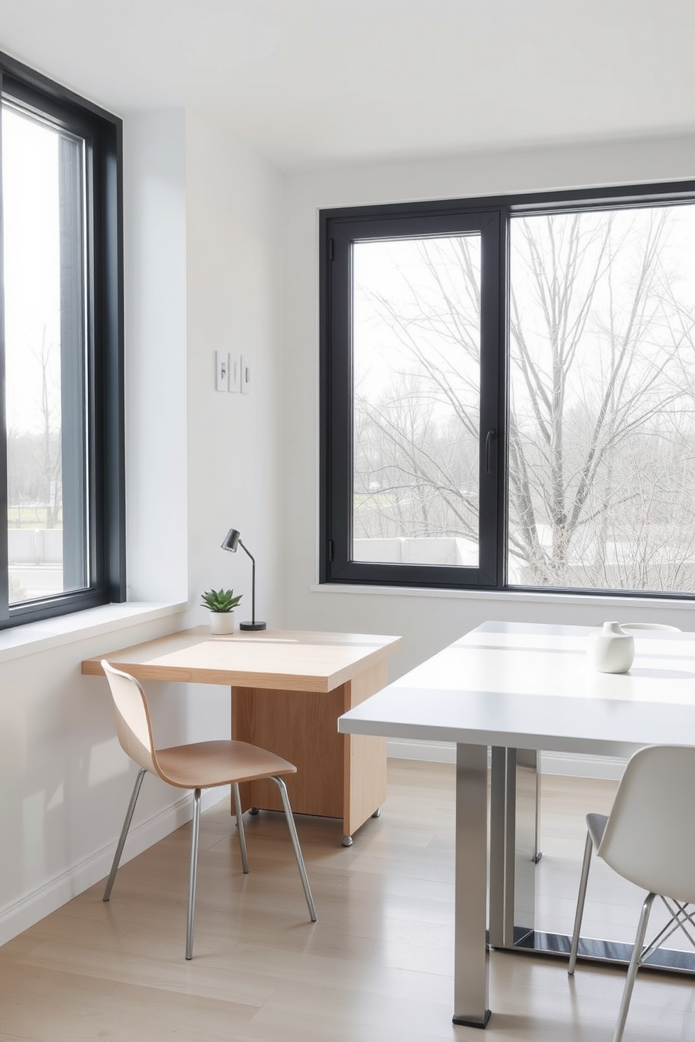 A minimalist desk is positioned beside a sleek dining table, creating a harmonious blend of work and dining spaces. The desk features a clean design with a light wood finish, complemented by a simple chair that matches the dining table aesthetics. Natural light floods the room through large windows, highlighting the neutral color palette of soft whites and light grays. Decorative elements are kept to a minimum, with a small potted plant on the desk and a simple centerpiece on the dining table.