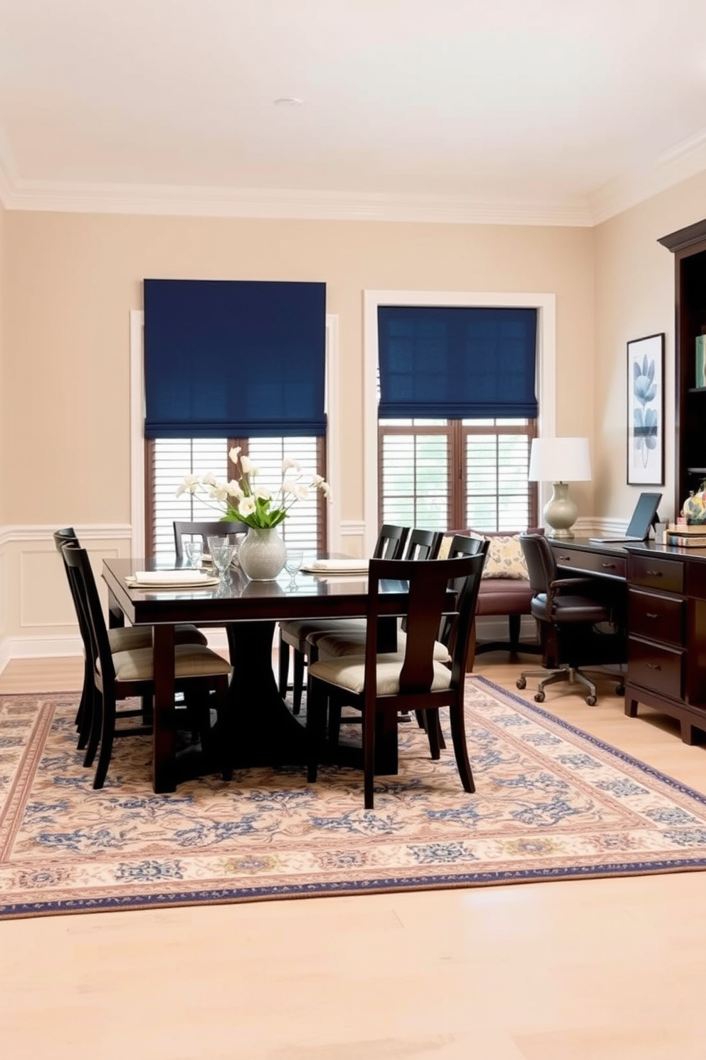 A harmonious dining room office combo features a cohesive color palette that blends soft neutrals with pops of deep blue. The dining table is surrounded by elegant chairs, while a stylish desk is positioned nearby, creating a seamless flow between the two spaces. The walls are painted in a warm beige, complemented by dark wood accents in the furniture. A large area rug anchors the space, tying together the dining and office areas while adding comfort and style.