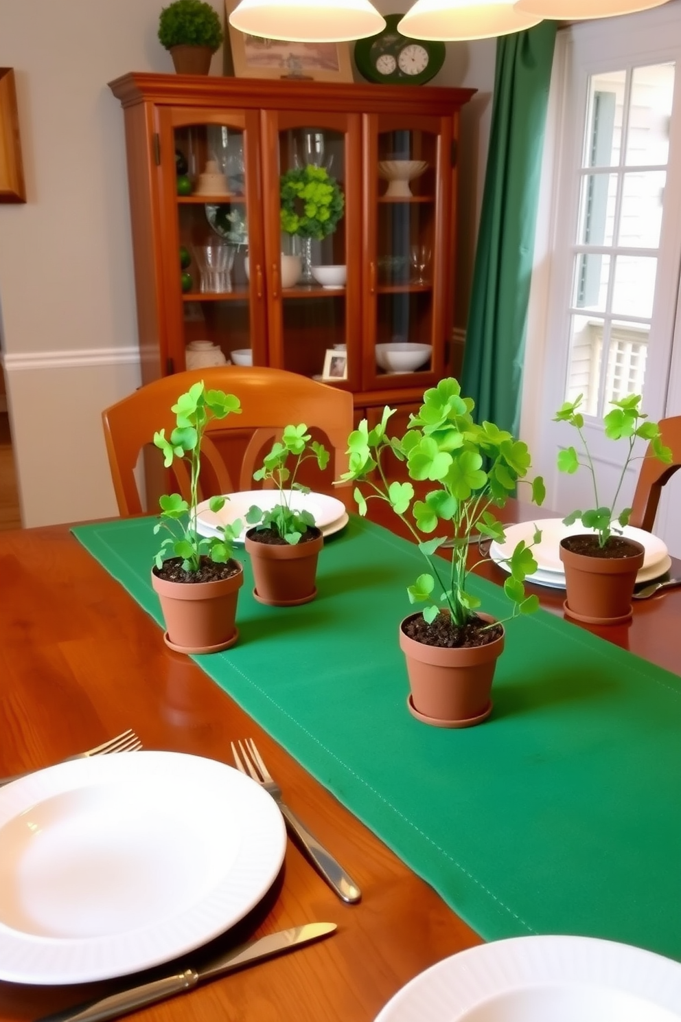 A cozy dining room setting adorned with potted shamrocks as table decor. The wooden dining table is elegantly set with white tableware and a green runner, creating a festive atmosphere for St. Patrick's Day.