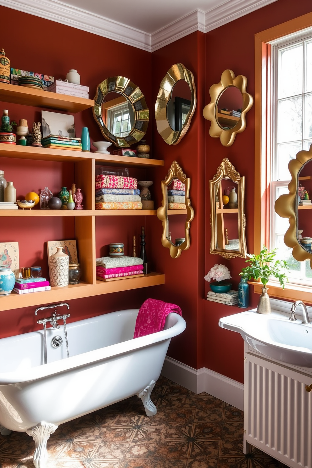 Open shelving displays a collection of curated items including colorful towels and unique decorative pieces. The walls are painted in a warm terracotta hue, complemented by a vintage-style clawfoot bathtub and a mix of patterned tiles on the floor. Artistic mirrors with irregular shapes adorn the walls, enhancing the eclectic feel of the space. Natural light floods in through a large window, highlighting the vibrant accessories and creating a welcoming atmosphere.