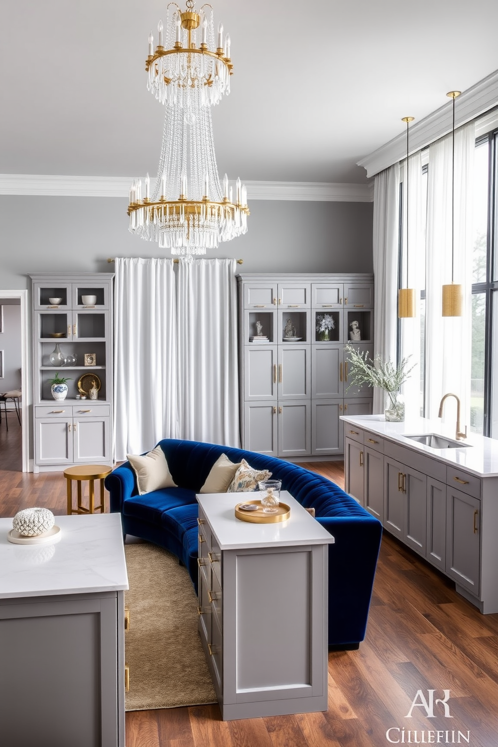 A chic living room featuring a plush velvet sofa in deep navy blue, complemented by a pair of gold-accented side tables. Above, a stunning chandelier with cascading crystals adds a touch of glamour, while large windows draped in sheer white curtains allow natural light to flood the space. A modern kitchen with sleek cabinetry in a soft gray tone, paired with a large island topped with white quartz. Statement pendant lights hang above the island, creating an inviting atmosphere perfect for entertaining guests.