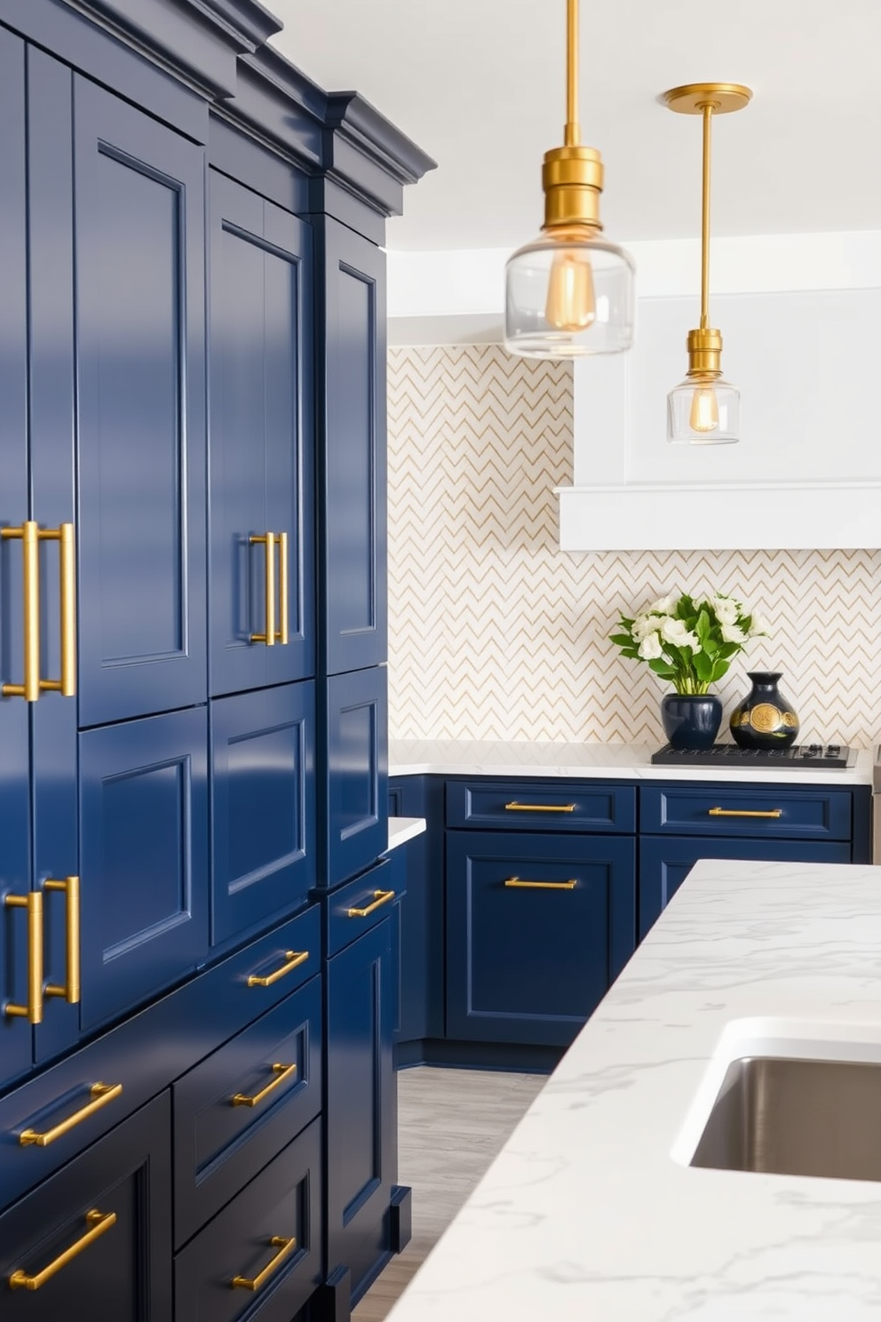 A luxurious kitchen space featuring brass fixtures that add a touch of elegance. The cabinets are a deep navy blue with gold handles, and the island is topped with a white quartz countertop. The backsplash is a stunning herringbone pattern made of white and gold tiles. Pendant lights with brass accents hang above the island, illuminating the space beautifully.