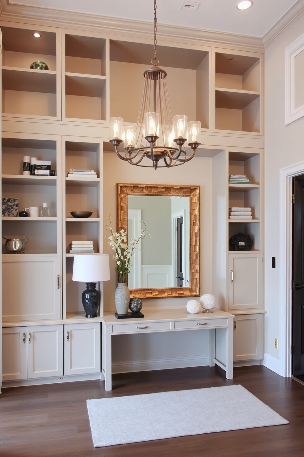 A stunning entrance foyer featuring a sleek console table with a minimalist design. The walls are painted in a soft gray tone, complemented by a large monochromatic artwork that adds depth to the space. The floor is adorned with a plush area rug in varying shades of gray, creating a welcoming atmosphere. A stylish pendant light hangs from the ceiling, casting a warm glow over the foyer and enhancing the elegant ambiance.