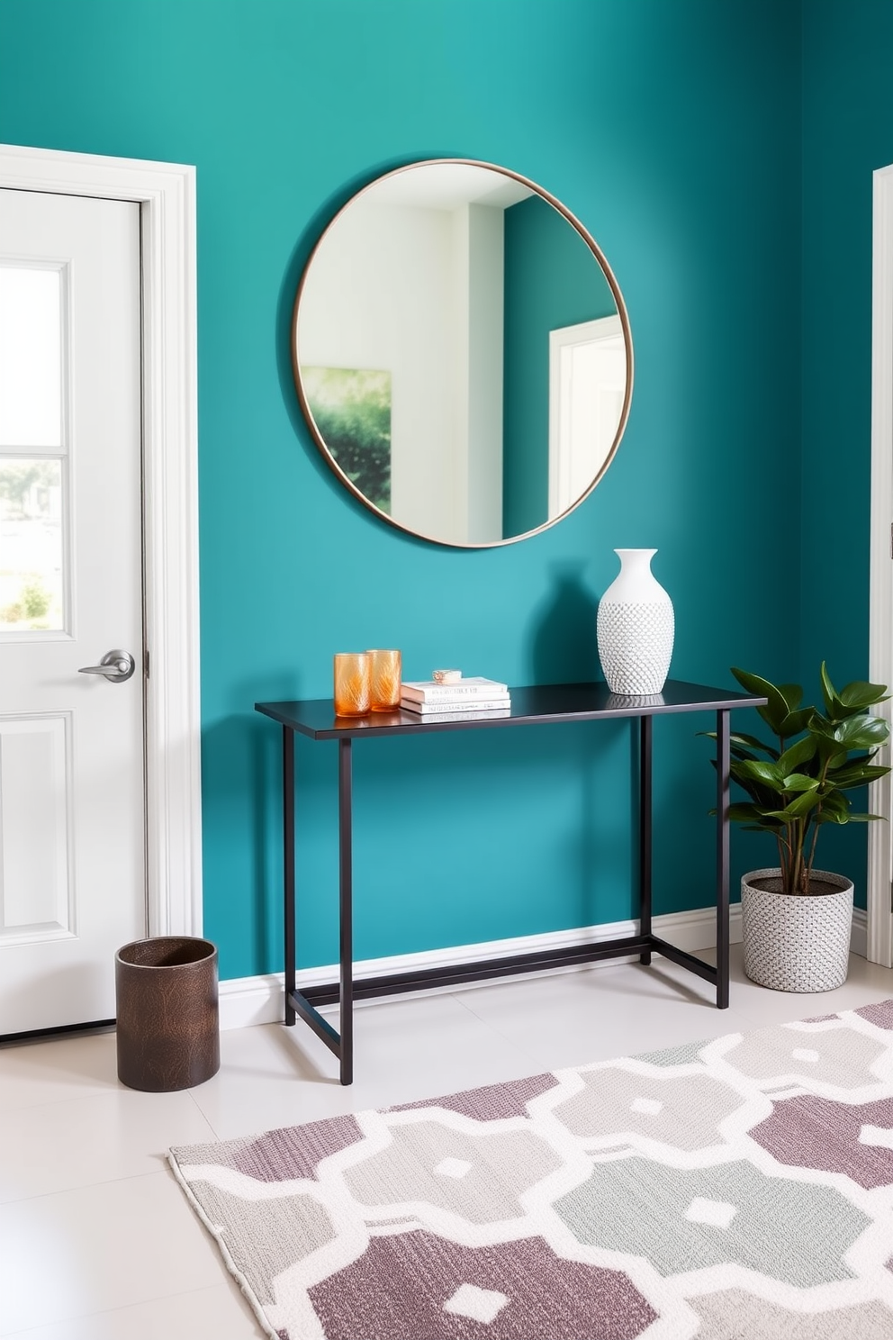 A vibrant accent wall painted in a bold teal adds a pop of color to the entryway. The space features a sleek console table topped with decorative items and a large round mirror that reflects light and creates an inviting atmosphere. The floor is adorned with a stylish geometric rug that complements the wall color. A potted plant sits in the corner, bringing a touch of nature and freshness to the design.