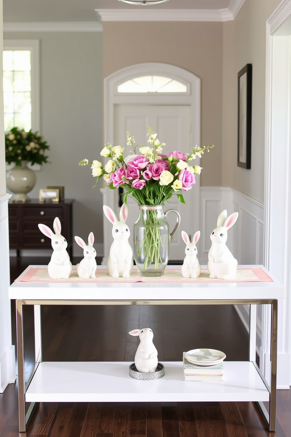 Charming ceramic bunnies are arranged on a sleek console table in a bright entryway. The table is adorned with a pastel-colored runner, and fresh flowers in a vase add a touch of springtime elegance.