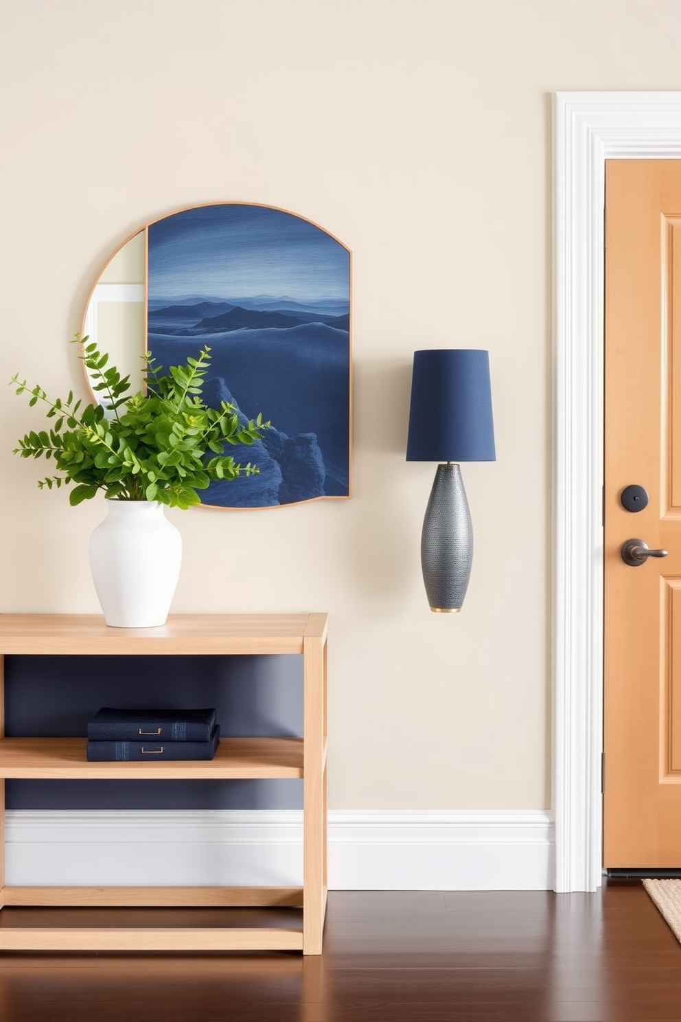 A cohesive color palette for visual harmony. The entryway features a soft beige wall with accents of deep navy blue in the decor. The entryway table is a sleek, modern design with a light wood finish. It is adorned with a simple arrangement of greenery and a decorative bowl in complementary colors.