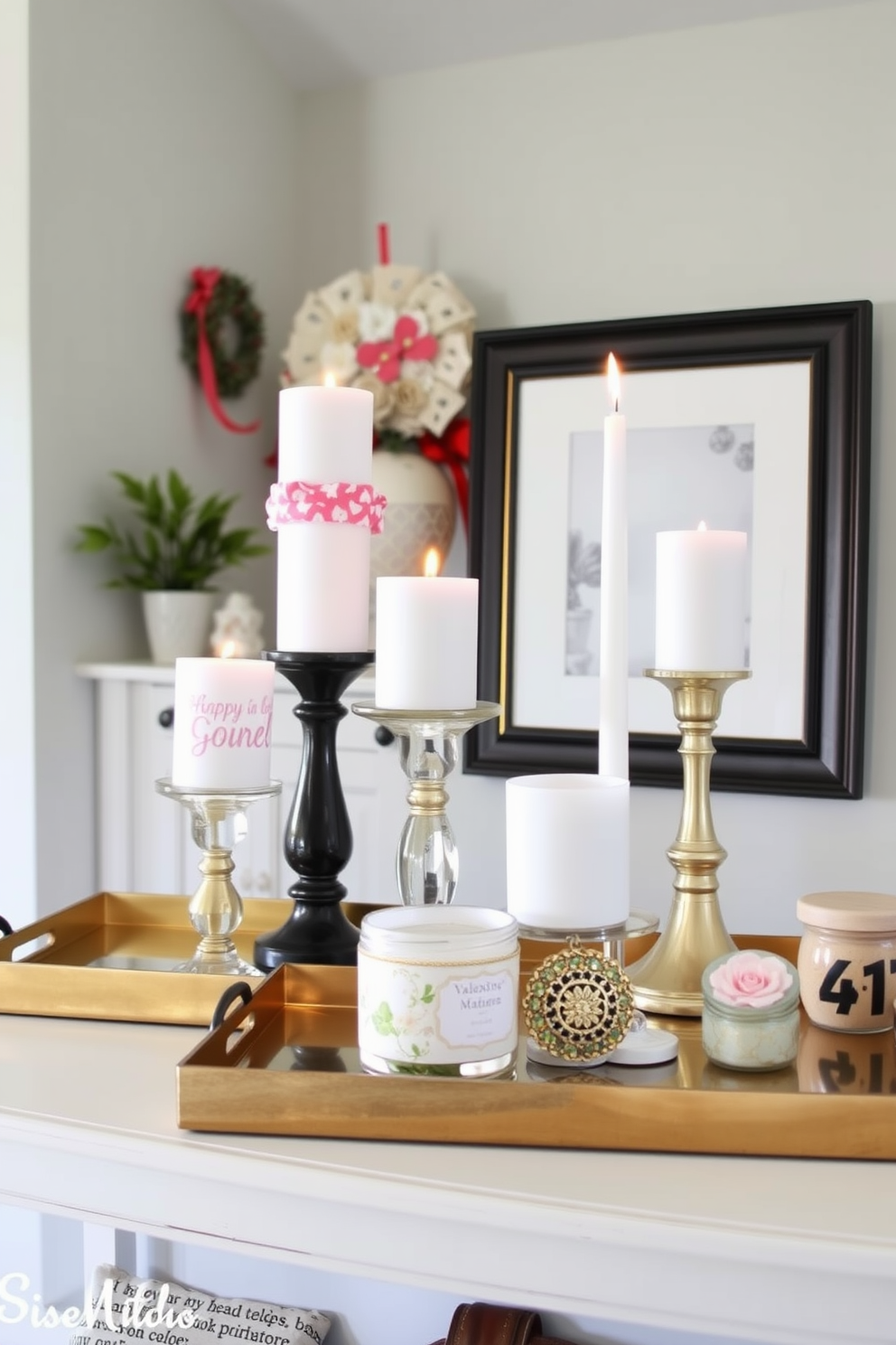 A stylish entryway featuring decorative trays arranged on a console table. The trays are adorned with themed candles in various heights and decorative accents that celebrate Valentine's Day.