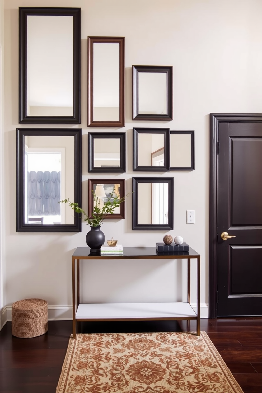 A stylish entryway features framed mirrors in varying sizes arranged asymmetrically on the wall, creating an eye-catching focal point. The mirrors reflect natural light, enhancing the warmth of the space, while a sleek console table below holds decorative items and a small plant. The wall is painted in a soft neutral tone, providing a perfect backdrop for the mirrors and adding depth to the entryway. A patterned runner rug adds texture and warmth, inviting guests into the home with a touch of elegance.