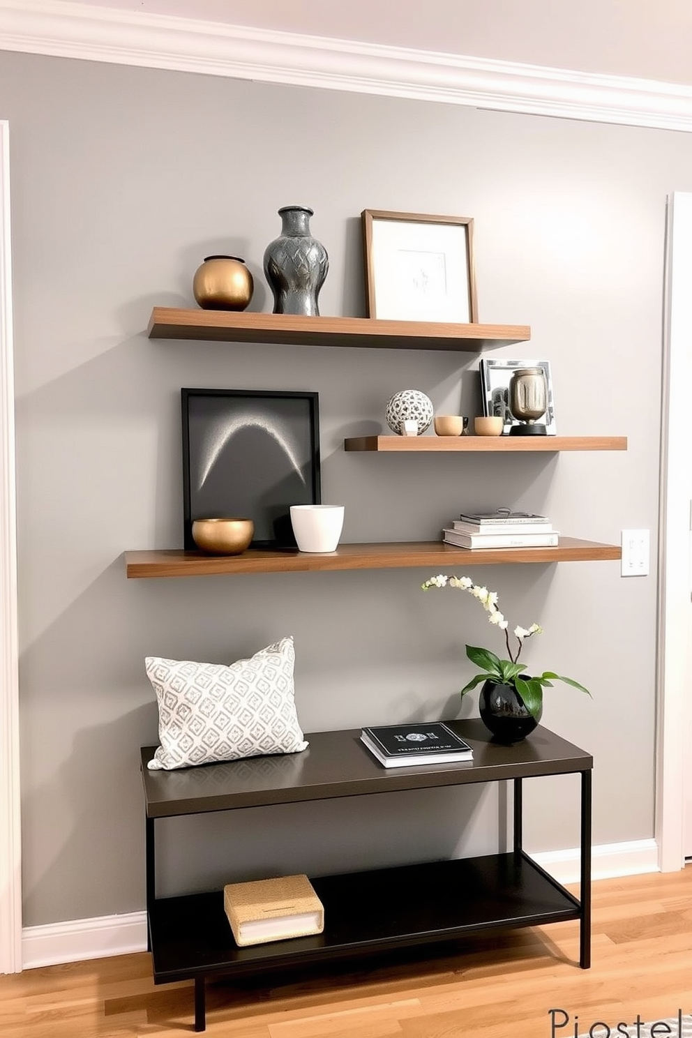 A stylish entryway features floating shelves adorned with carefully curated decorative items. The walls are painted in a soft gray hue, complemented by a sleek console table beneath the shelves.