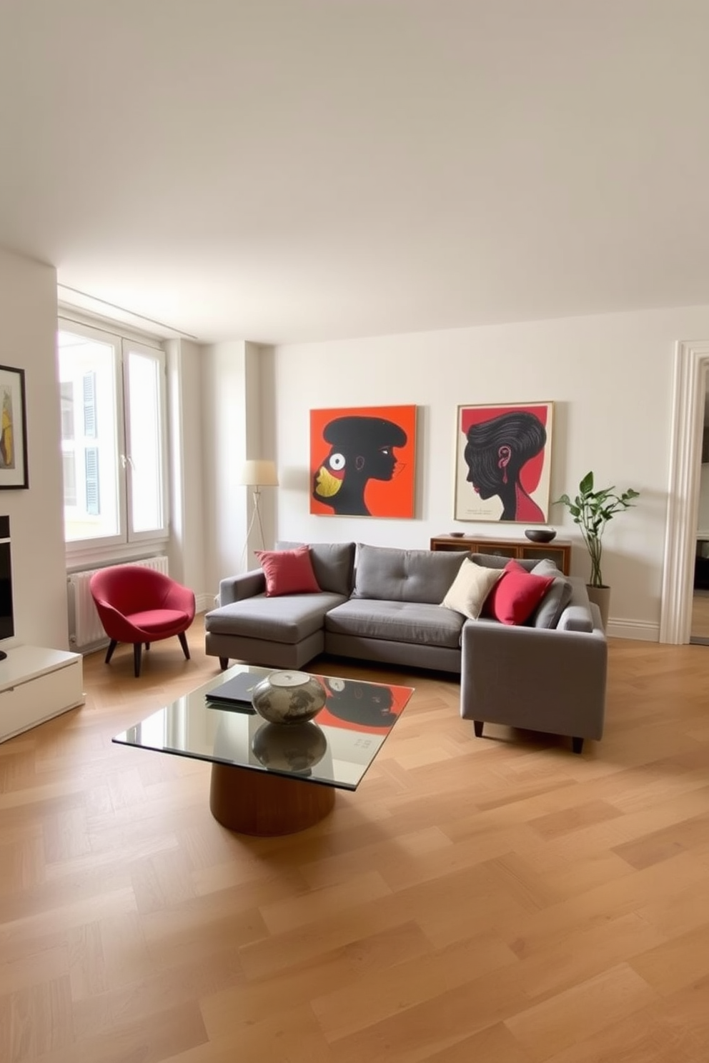 A chic European apartment featuring a neutral color palette with soft beige walls and light oak flooring. The space is adorned with bold artwork that adds vibrant splashes of color, creating a striking contrast against the serene backdrop. The living area includes a plush gray sofa paired with a sleek glass coffee table. Large windows allow natural light to flood the room, enhancing the inviting atmosphere and highlighting the eclectic art pieces on display.