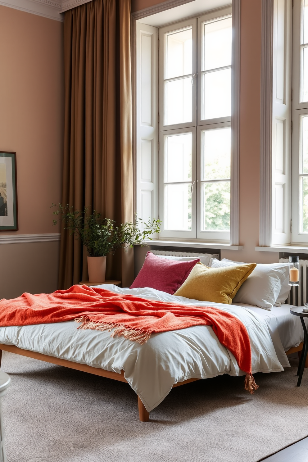 A serene European bedroom setting featuring neutral bedding layered with vibrant colorful throws. The walls are adorned with soft pastel shades, and large windows allow natural light to fill the space.