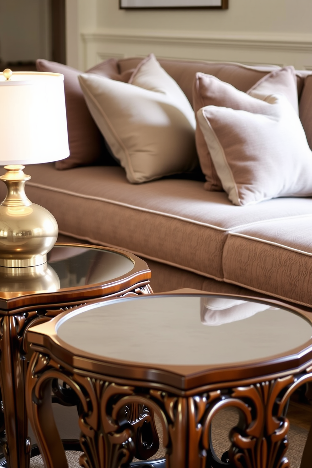 Elegant side tables for functional decor. The tables feature intricate woodwork, with a polished finish that reflects the ambient light. In the background, a plush sofa is adorned with decorative pillows in muted tones. A stylish lamp rests on one of the tables, casting a warm glow across the room.