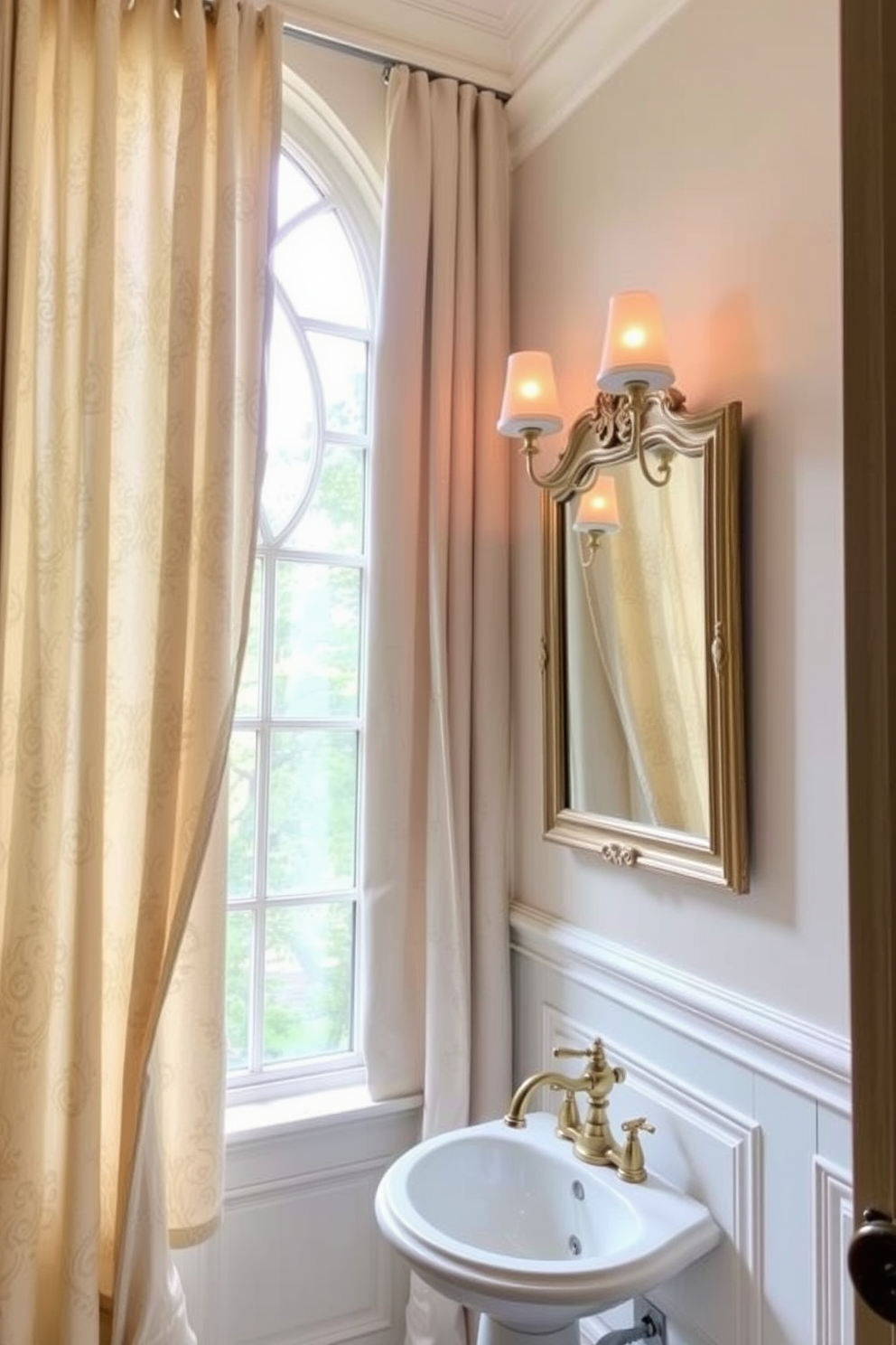 Elegant drapery cascades from the ceiling, framing a beautifully designed window that allows soft natural light to filter in. The fabric features intricate patterns in soft hues, enhancing the overall sophistication of the space. The European powder room boasts a stunning pedestal sink with a vintage gold faucet, complemented by a wall-mounted mirror adorned with decorative molding. Light fixtures with a warm glow illuminate the room, creating an inviting atmosphere.