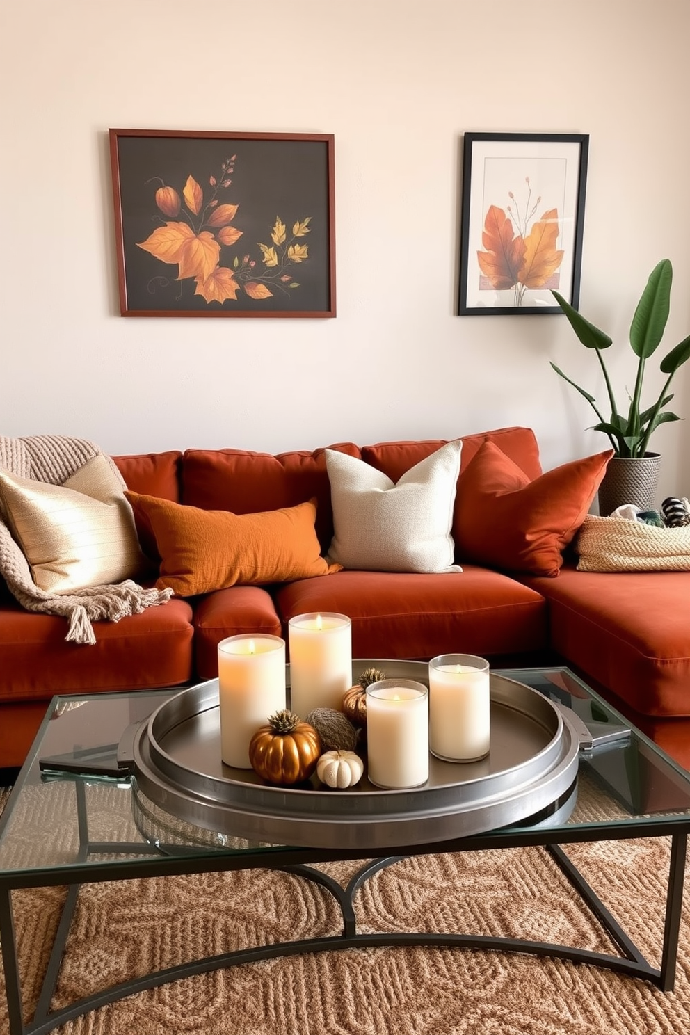 A cozy fall apartment setting featuring a warm color palette of deep oranges and rich browns. The living area has a plush sofa adorned with metallic-accented throw pillows and a soft knit blanket draped over the armrest. A stylish coffee table sits in front of the sofa, topped with a metallic tray holding candles and seasonal decor. The walls are adorned with framed autumn-themed artwork, and a few potted plants add a touch of greenery to the space.